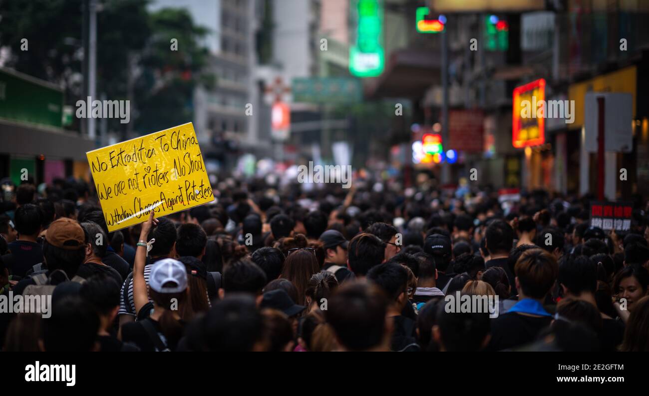 HONG KONG, CHINA - Jun 16, 2019: HONG KONG - JUN 16, 2019: Anti-Extradition Bill Protest in Hong Kong on 16 June 2019. Holding a poster of 'No Extradi Stock Photo