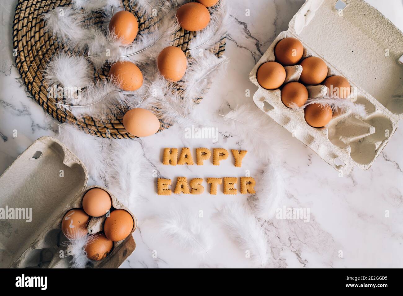 Creative bright composition with festive atmosphere. Easter holiday decorations on marble background. Stock Photo
