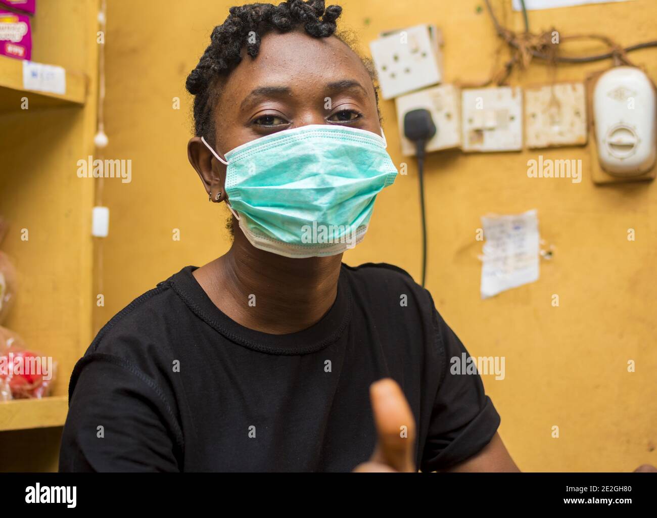 African woman in a facemask hi-res stock photography and images - Alamy