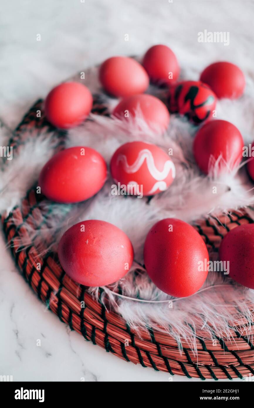 Abstract red eggs on white fluff close-up. Easter Spring concept Stock Photo