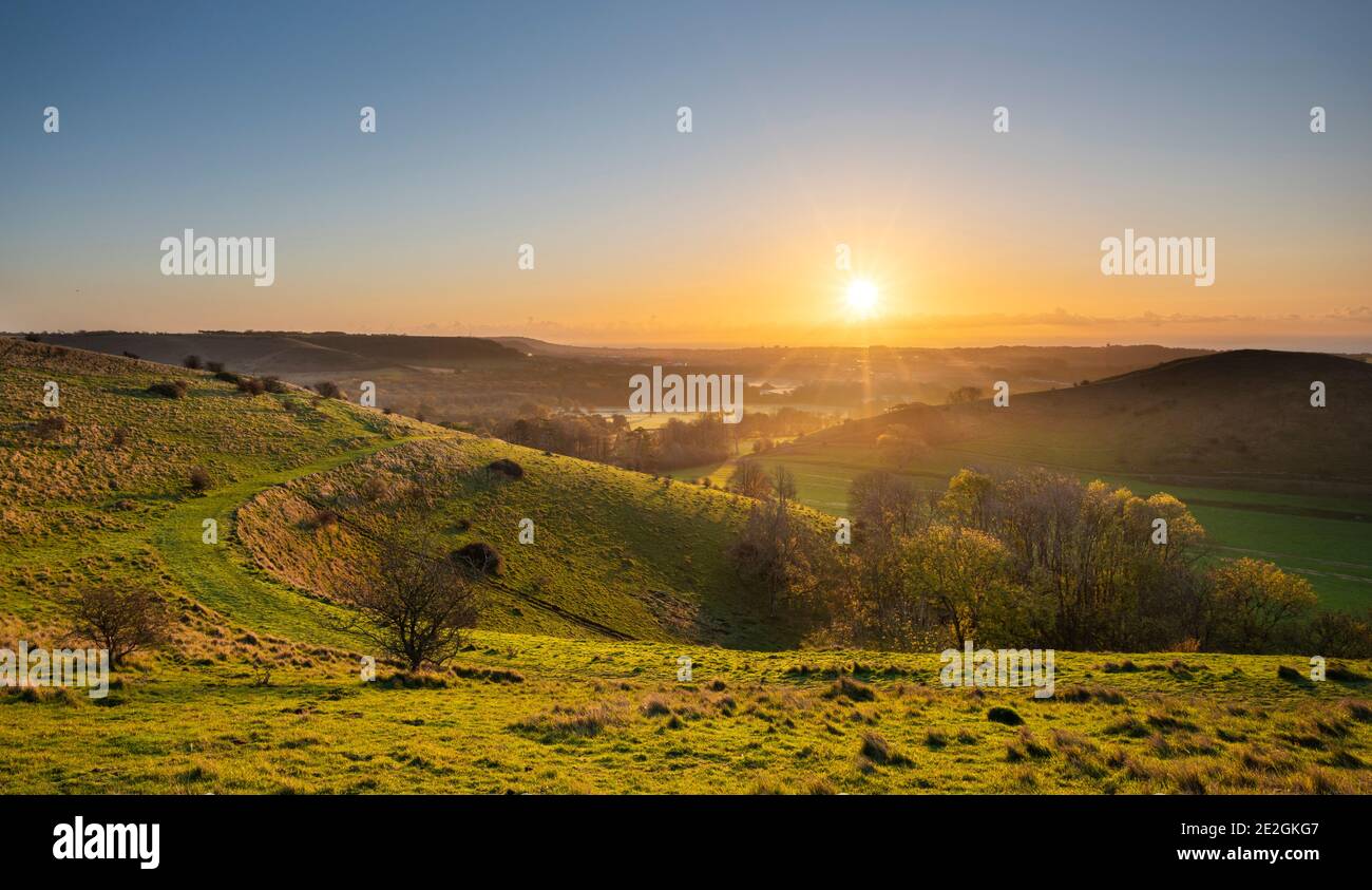 Sunrise on the Folkestone Downs; part of the Kent Downs AONB. Stock Photo