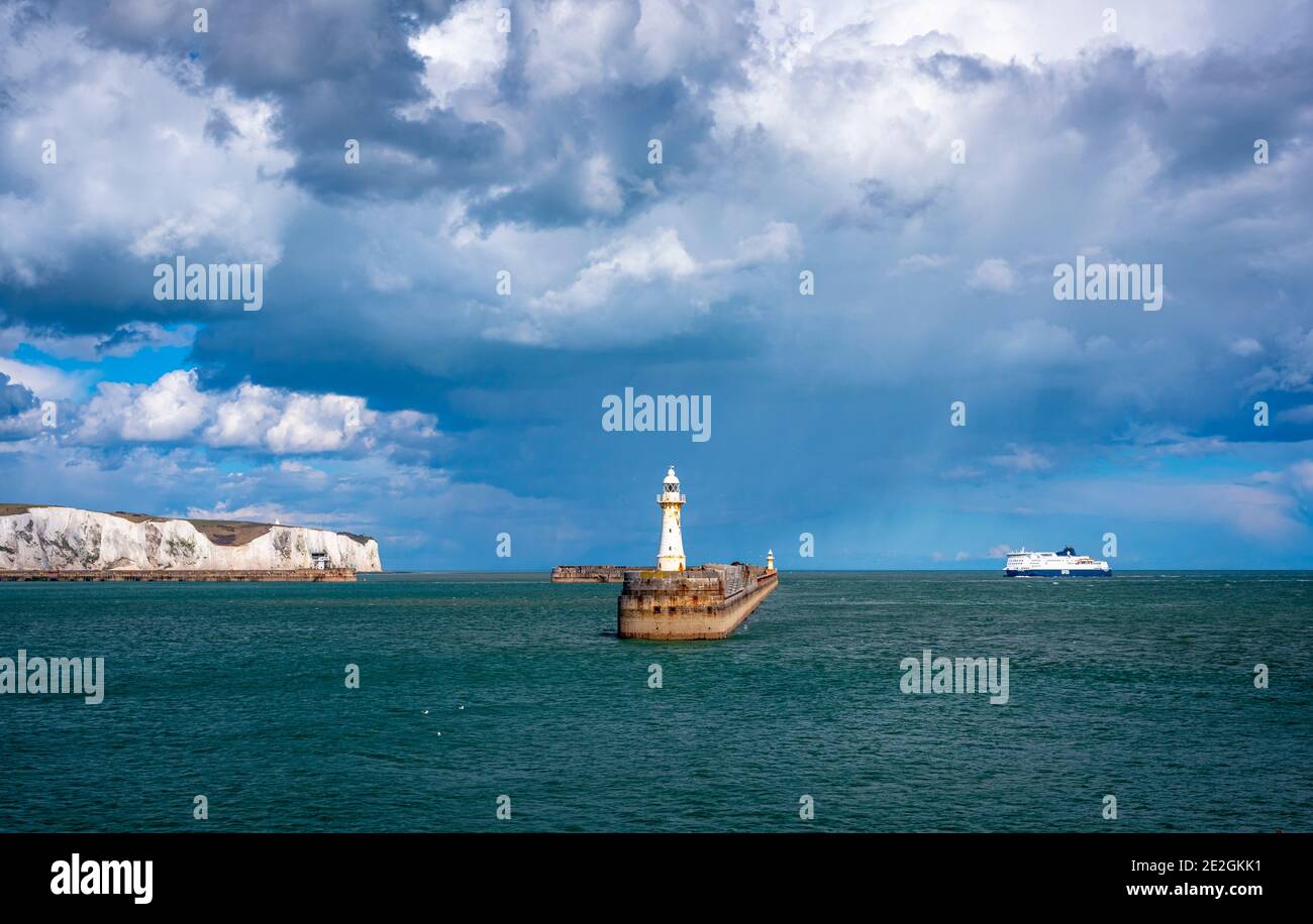 An incoming ferry into the Port of Dover with the White Cliffs seen in the background. Dover, Kent Stock Photo