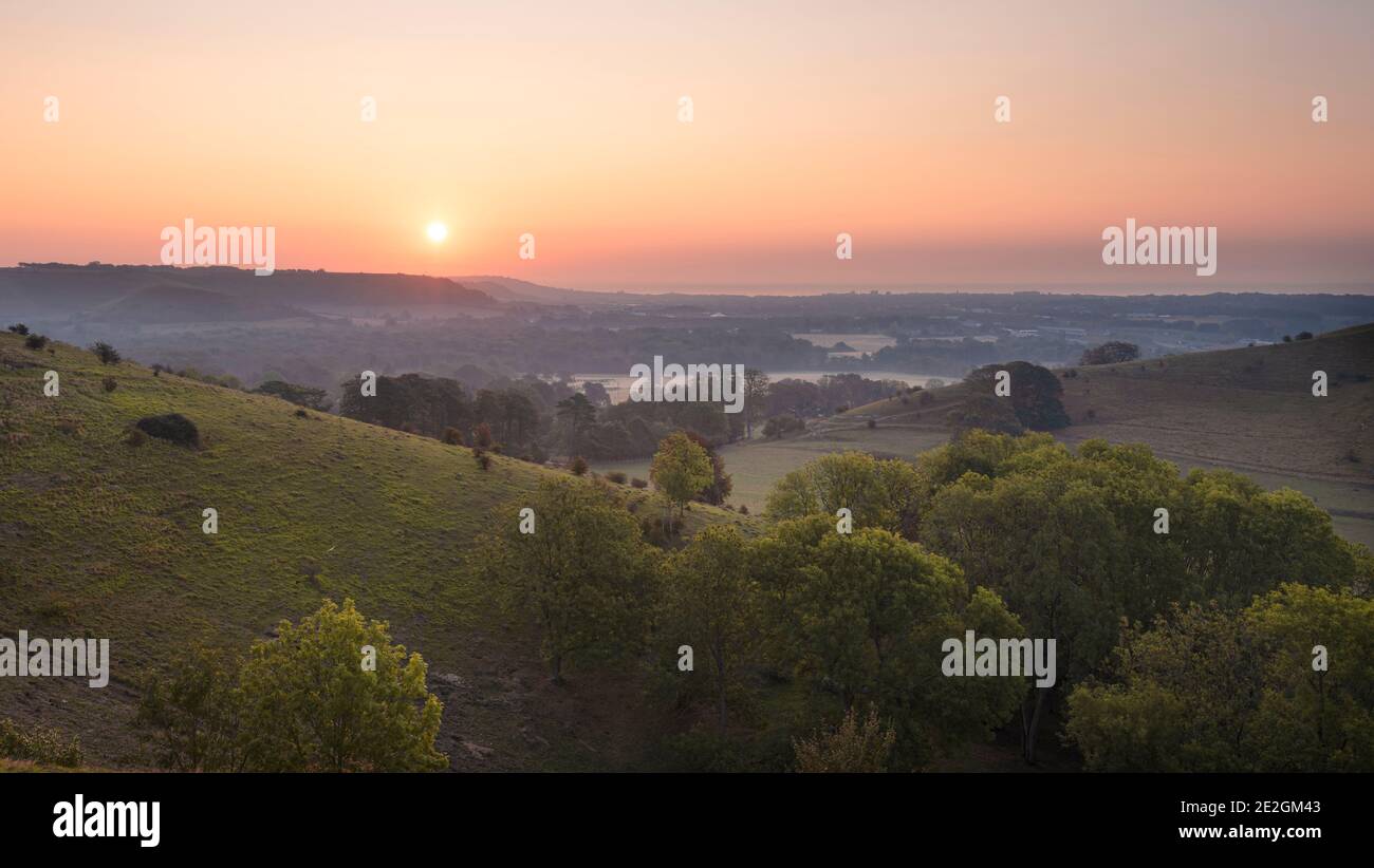 A view from the Kent Downs AONB near Folkestone at sunrise. Stock Photo