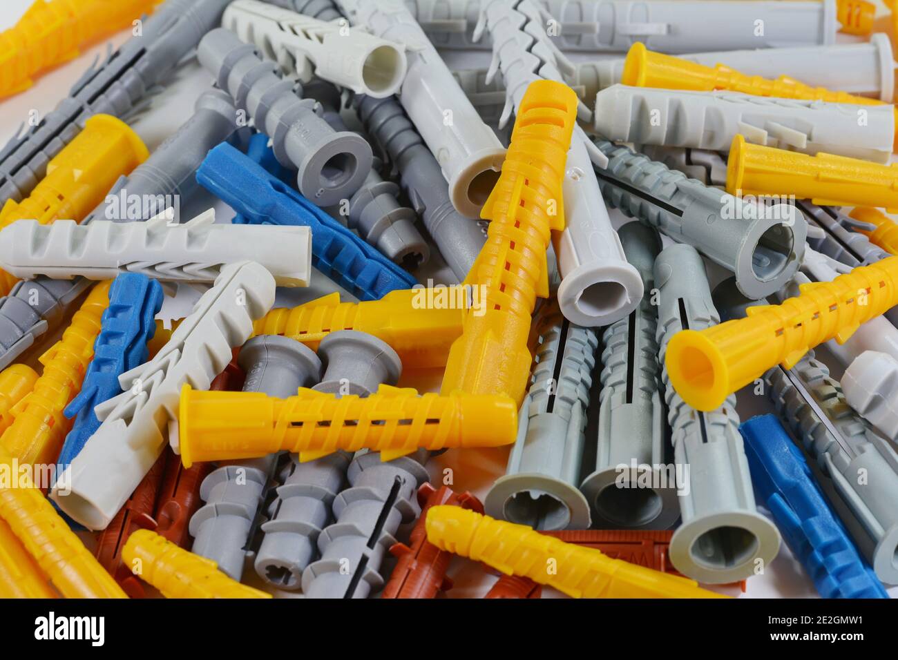 Wall plug also known as screw anchor or dowel, in different colors and sizes on one pile