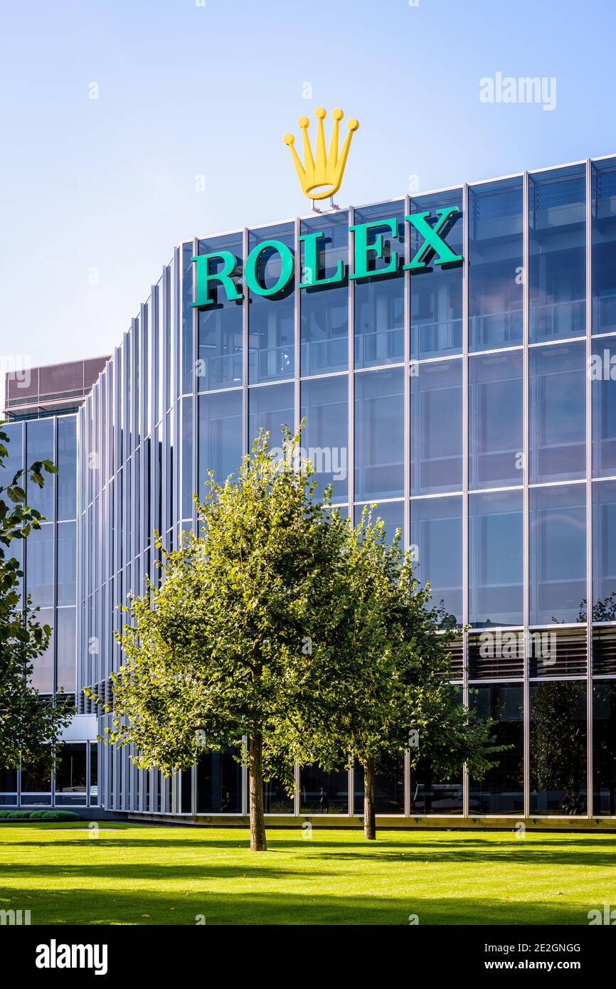 Glass facade of the headquarters of Rolex, the swiss brand of luxury watches, in Geneva. Stock Photo