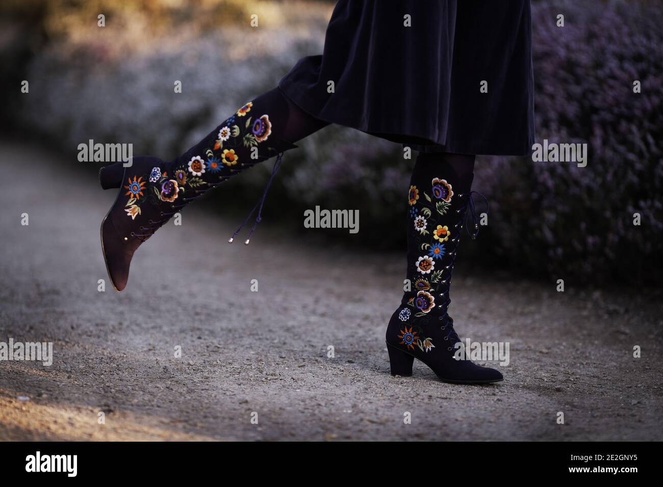 Boots are purple embroidered deerskin by Edouard Jerrold c.1969. Stock Photo