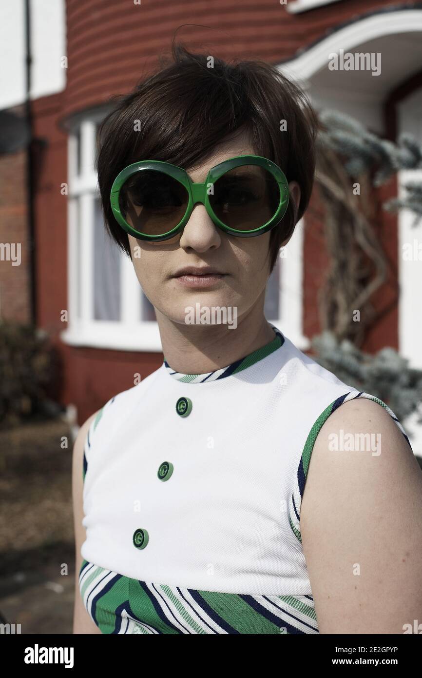 GREAT BRITAIN /England /London/ Girl in retro, vintage clothing posing in sunglasses. Stock Photo