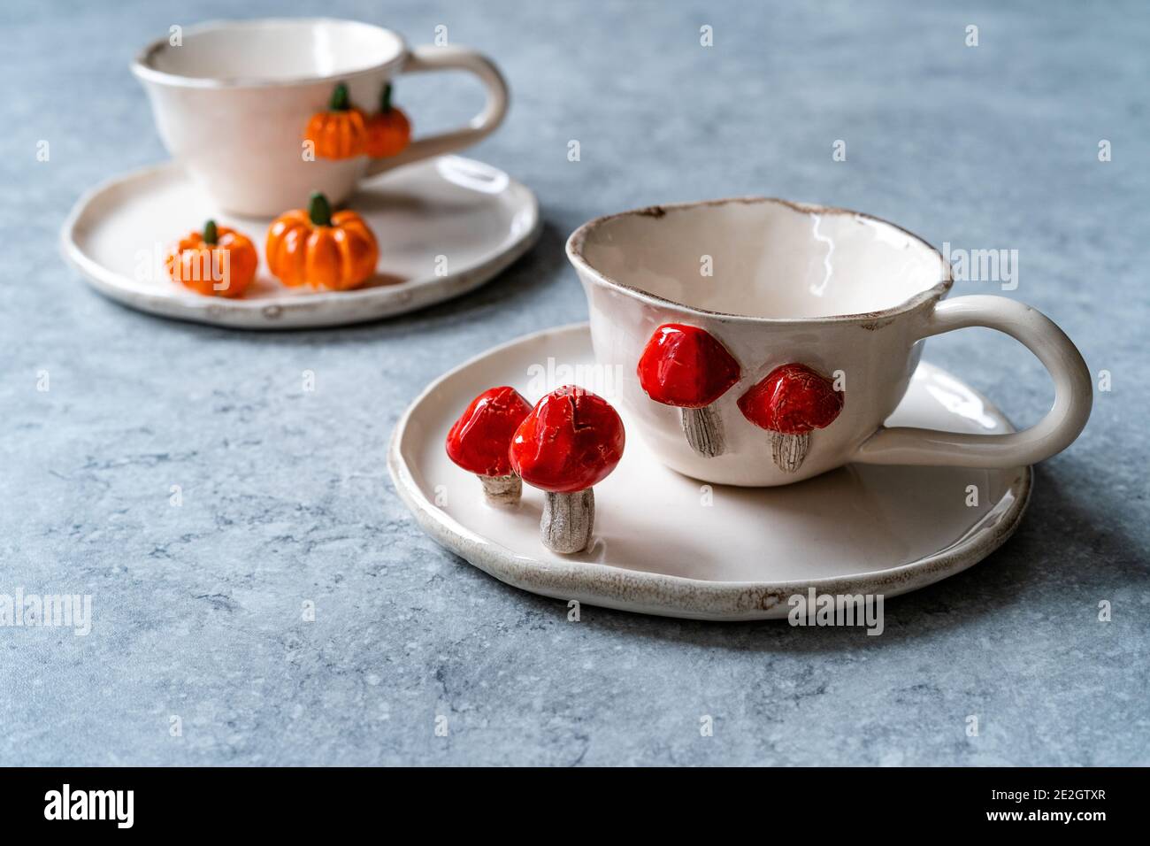 Handmade Ceramic Coffee or Tea Cups with Pumpkin and Mushroom Pattern  Figure Design Handcrafted. Handicraft. Ready to Use Stock Photo - Alamy