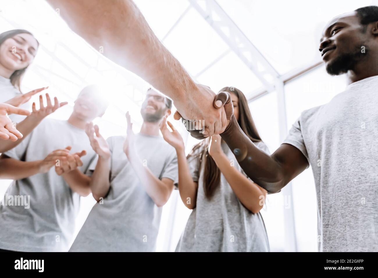 close up. two young opponents shake hands. Stock Photo
