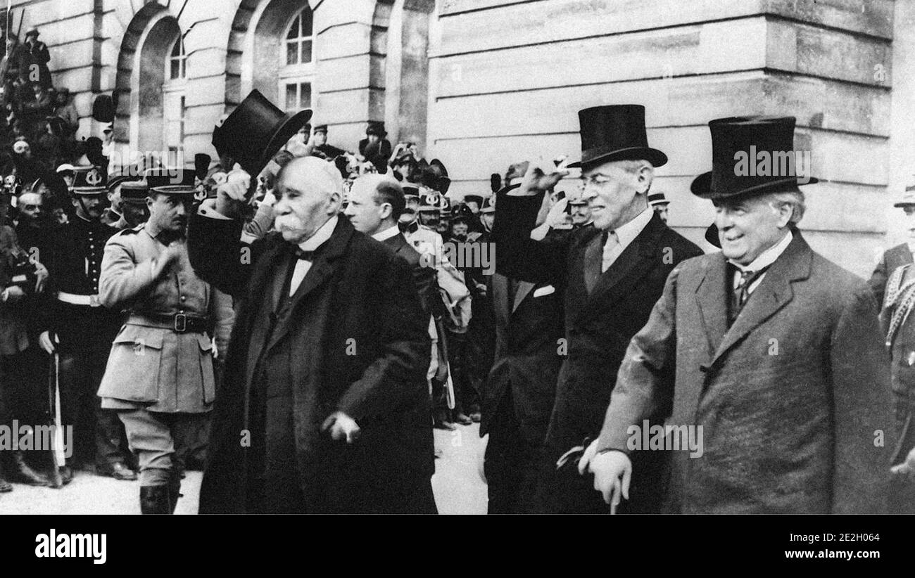 French Premier Georges Clemenceau, American President Woodrow Wilson and British Prime Minister Lloyd George after signing the treaty of Versailles at Stock Photo