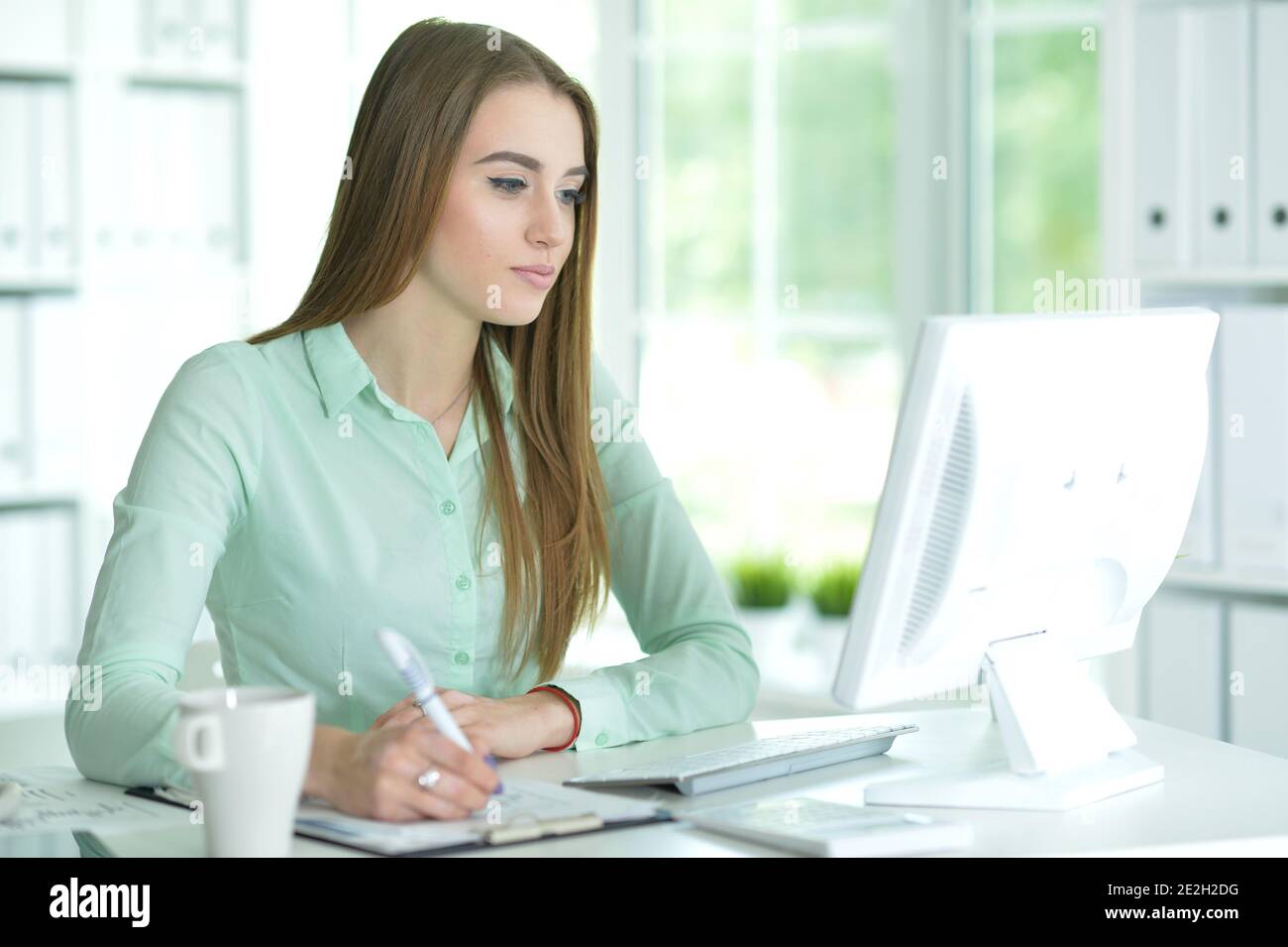 Portrait of a businesswoman working in office Stock Photo - Alamy