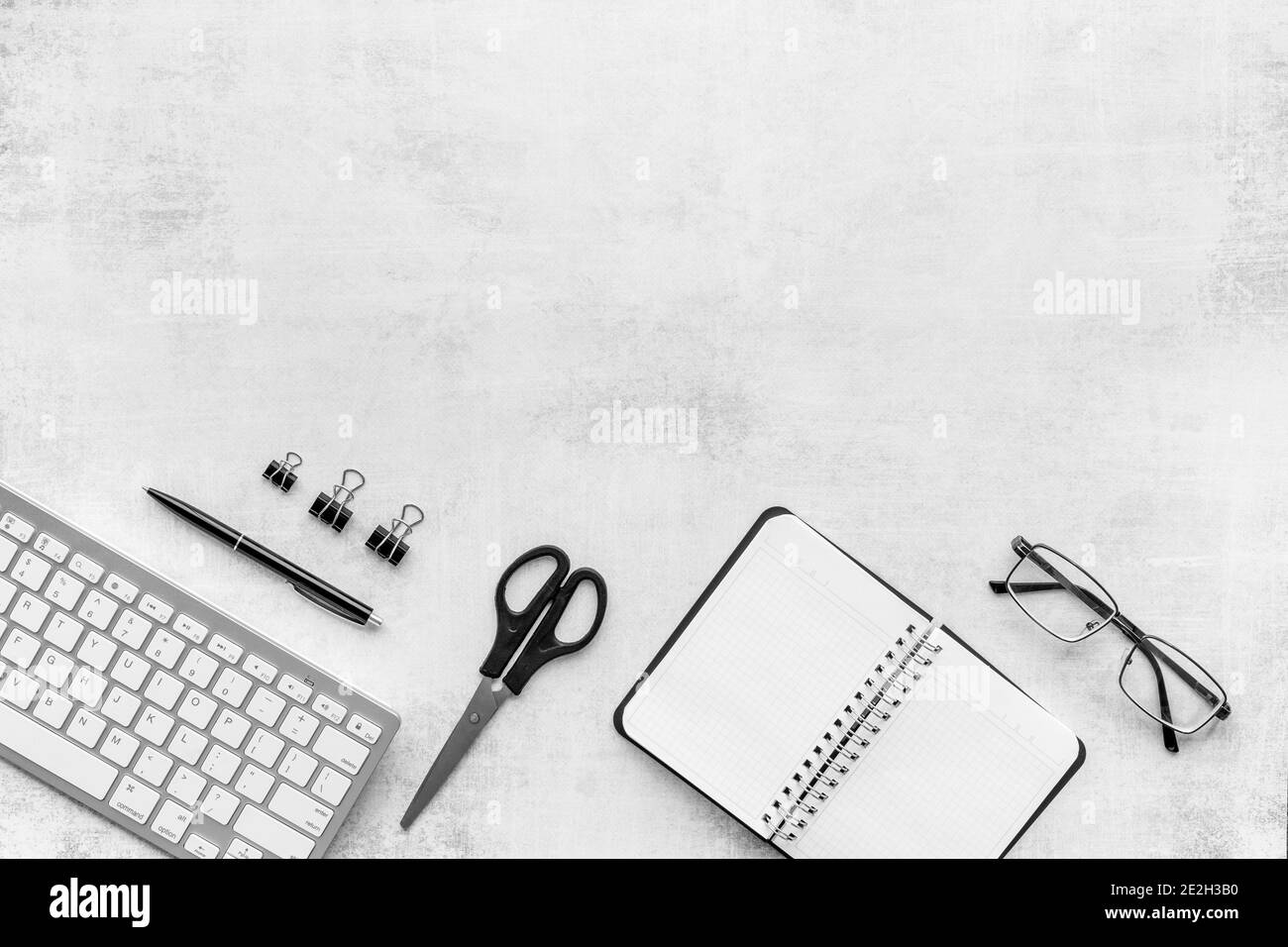 Flat lay workplace office desktop with keyboard and office supplies