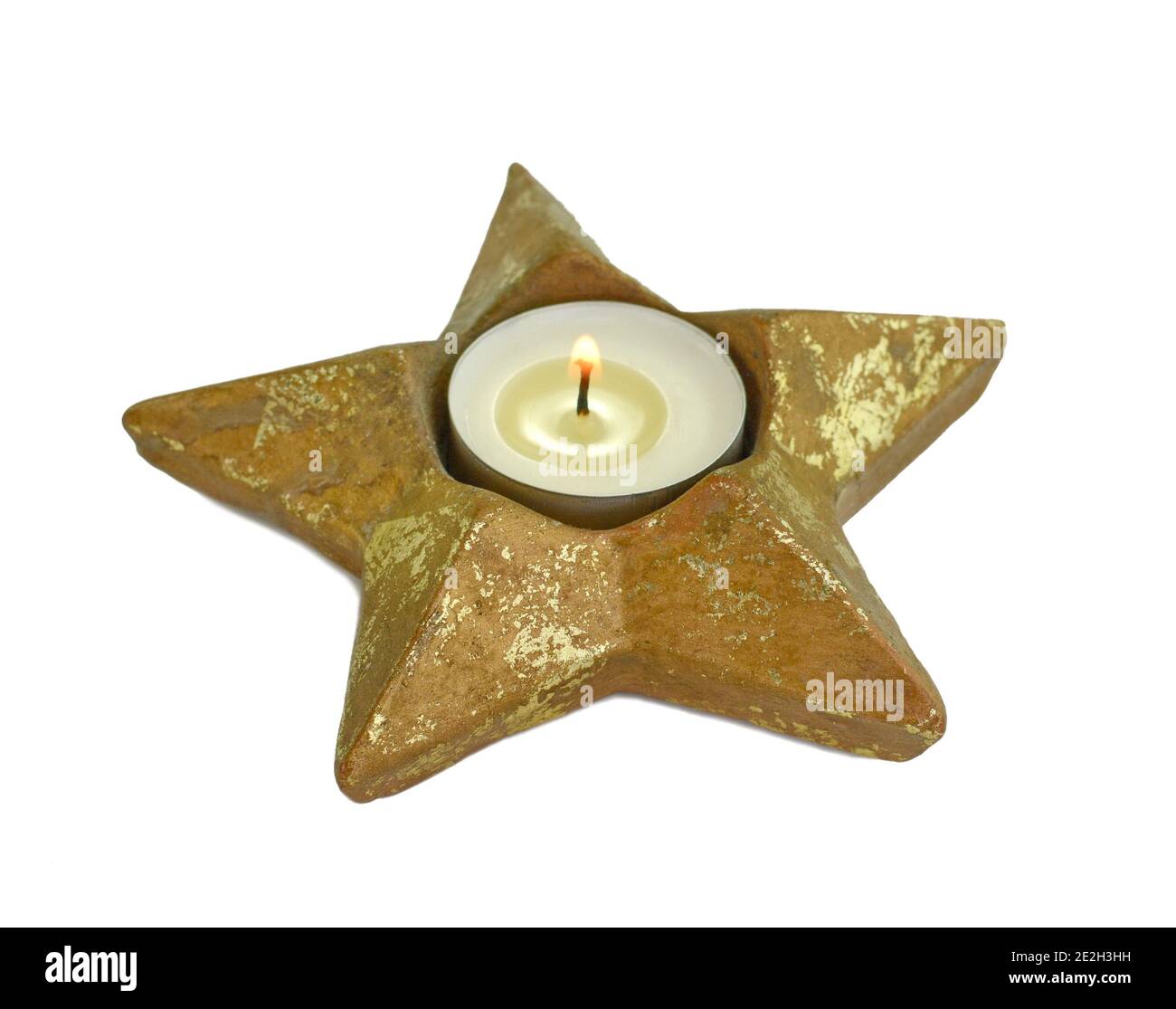 A tea light isolated on white with clipping path. Candle with stand in ...