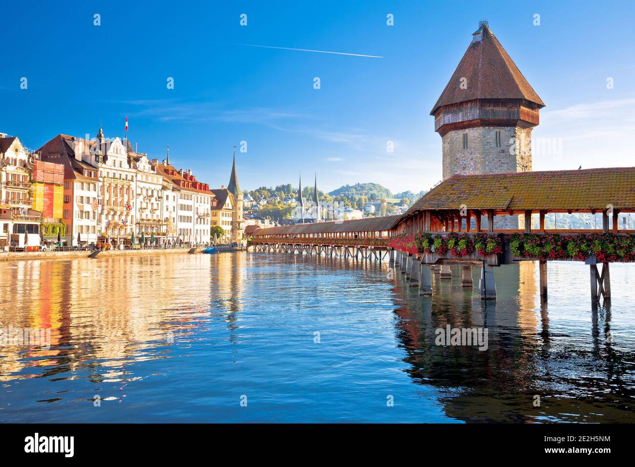 Luzern wooden Chapel Bridge and tower panoramic view, landmark in town in central Switzerland Stock Photo