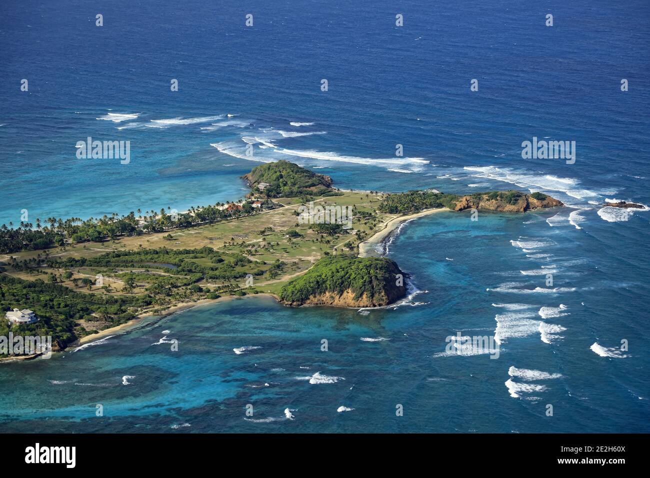 Caribbean, Saint Vincent and the Grenadines: aerial view of Palm Island which houses a small resort and and about twenty private residences Stock Photo