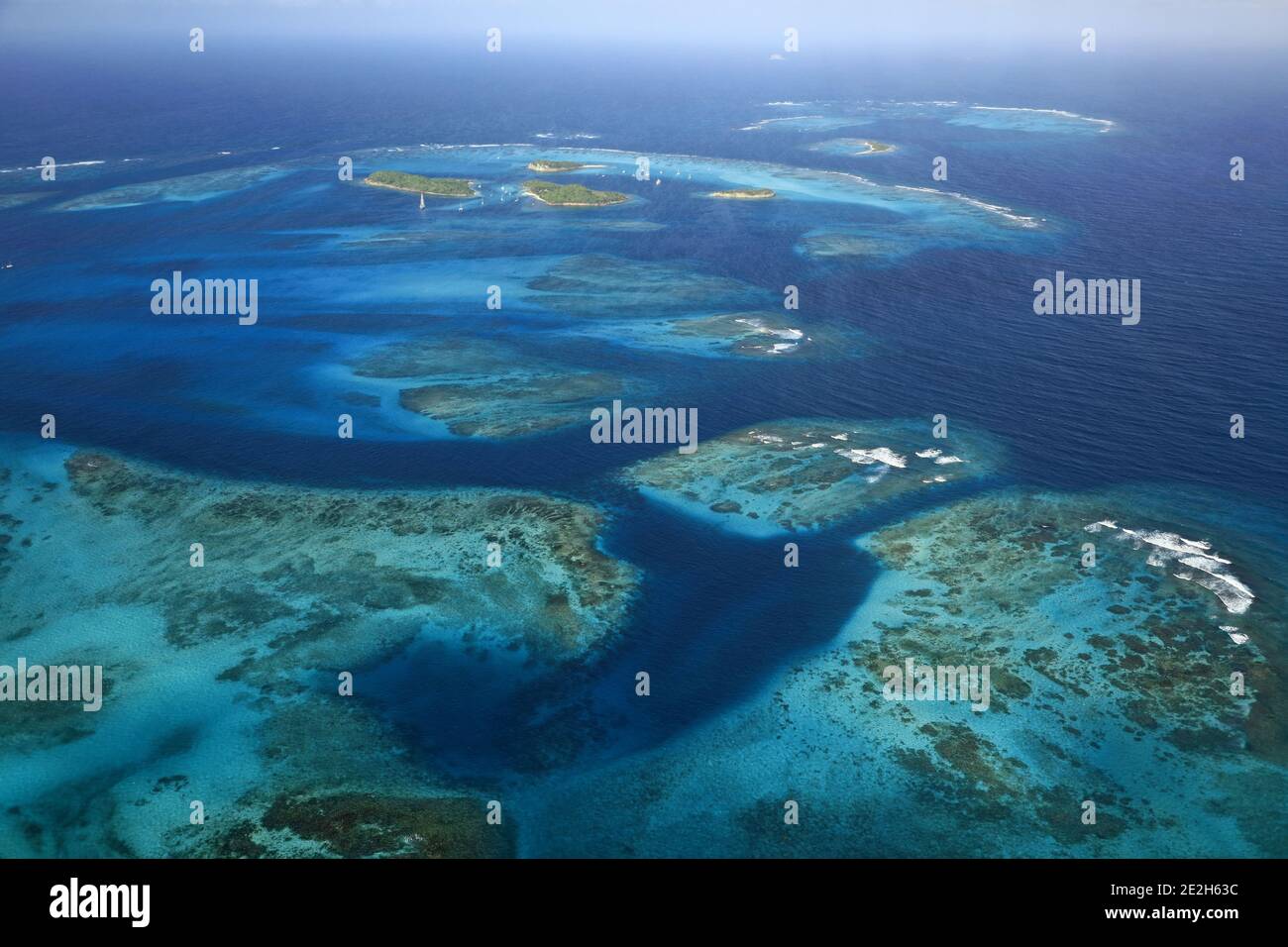 Caribbean, Saint Vincent and the Grenadines: aerial view of the small group of islands of the archipelago of Tobago Cays in the heart of the Tobago Ca Stock Photo