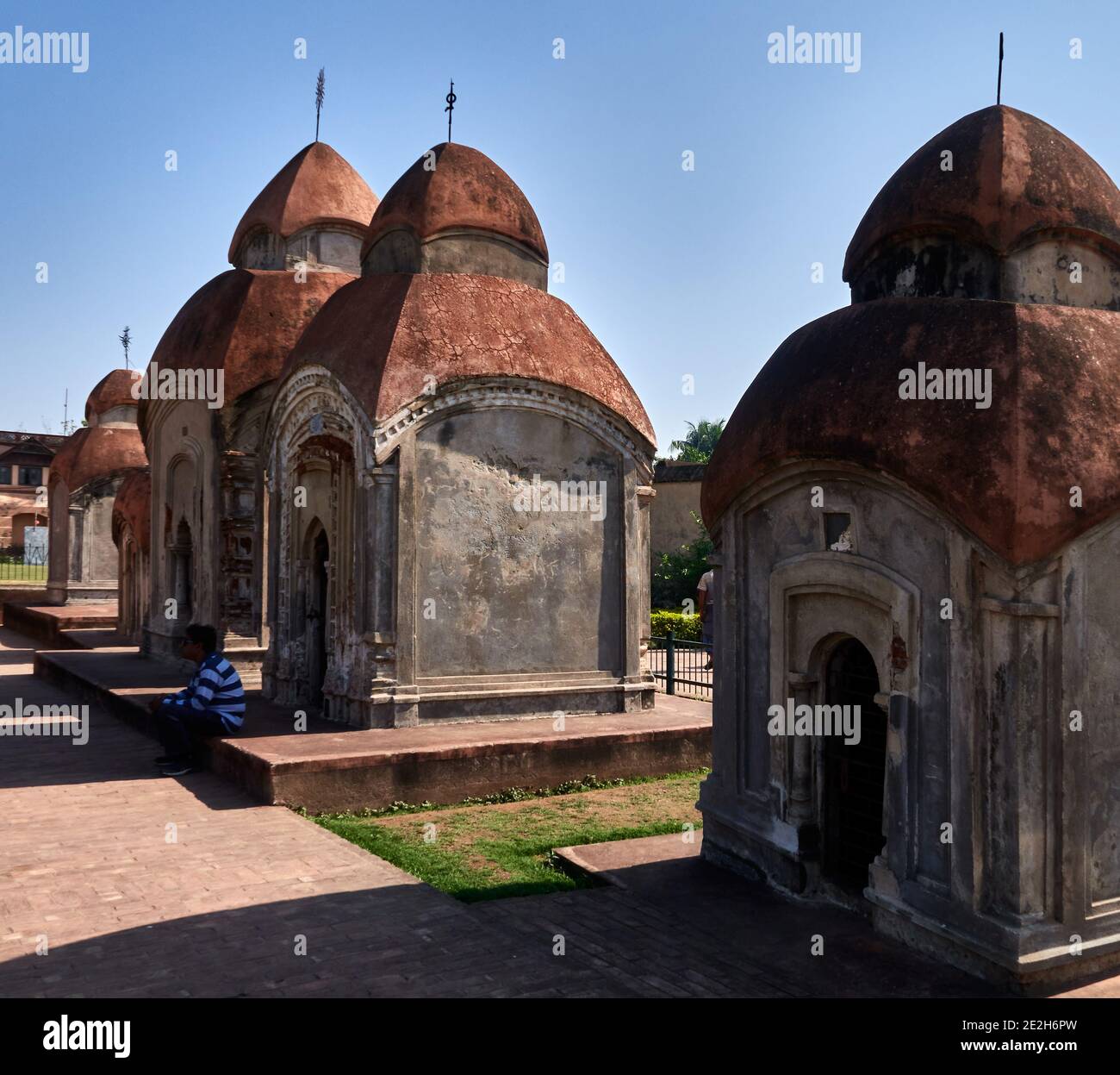 Kalna City, West Bengal, India. These Atchala (four sloped roof) brick built temples, raised on low platforms of varying sizes were built in 19th cent Stock Photo