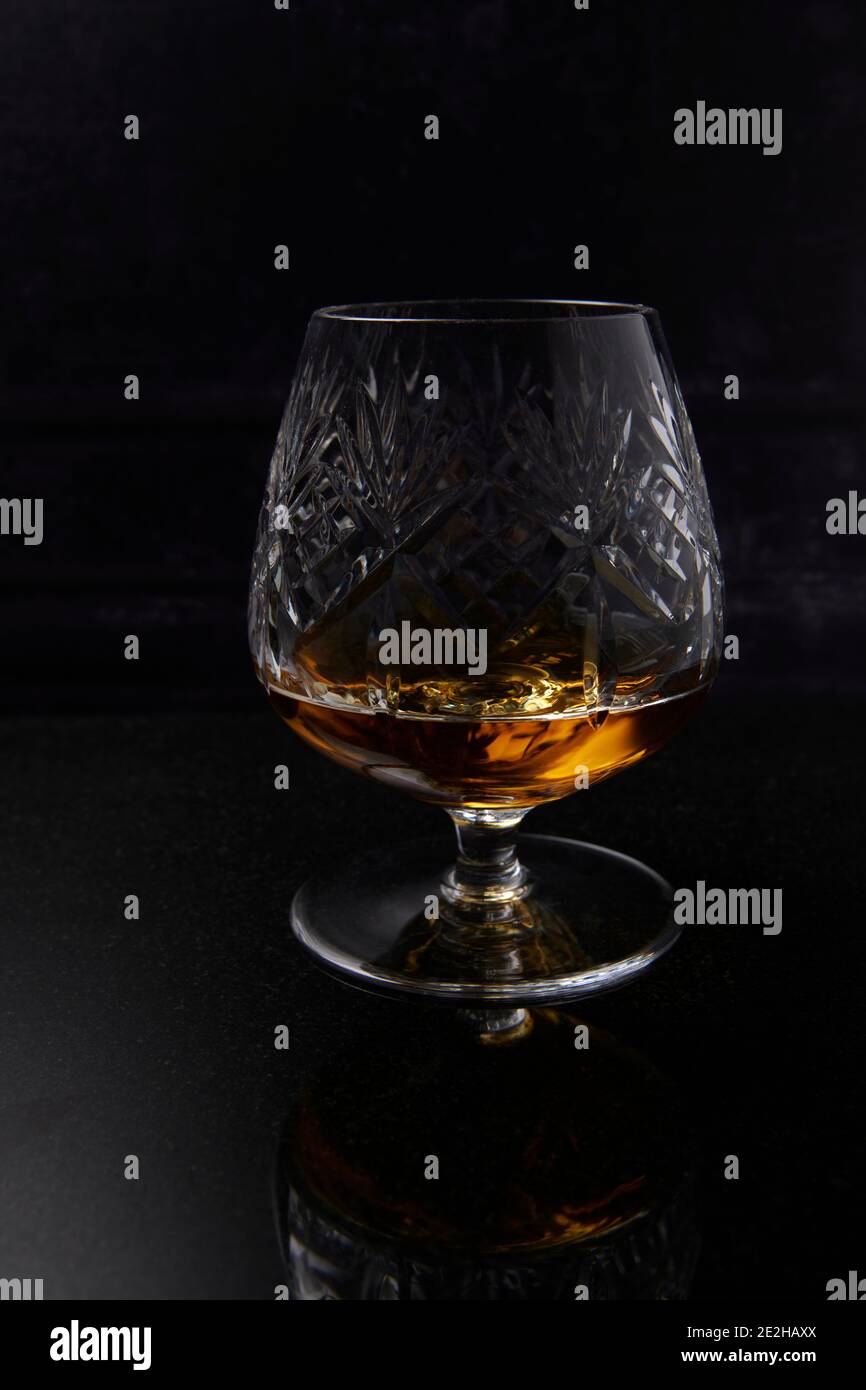 Brandy, Cognac, in Brandy Balloon, cut crystal glass Stock Photo Alamy