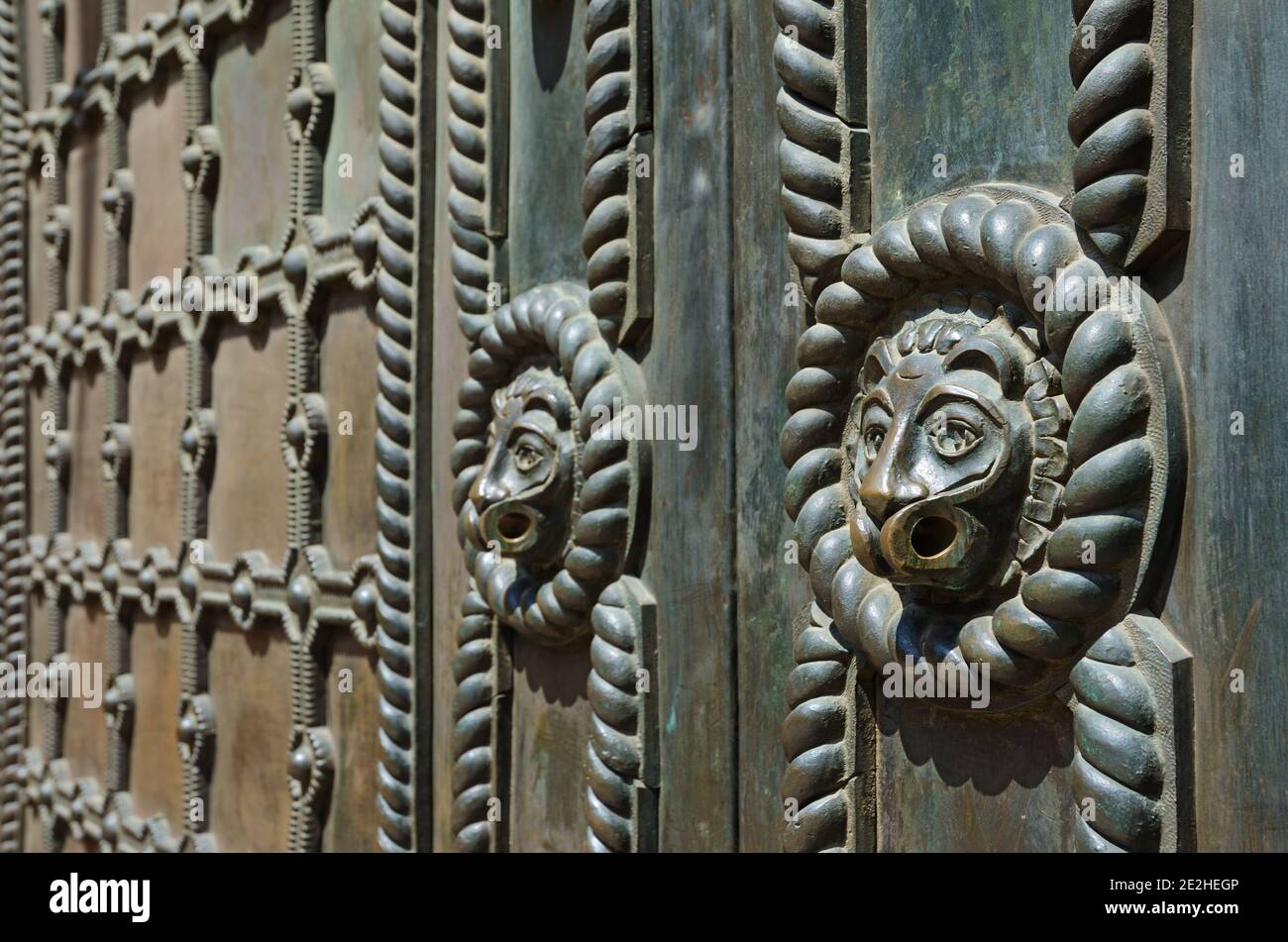 Bronze surface decoration with lions and grid on Golden Gate entrance door in Kyiv, Ukraine Stock Photo