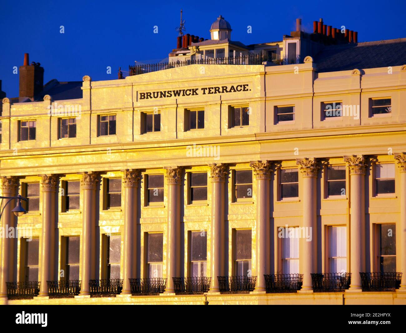 Brunswick Terrace in Brighton cloaked in early evening light Stock