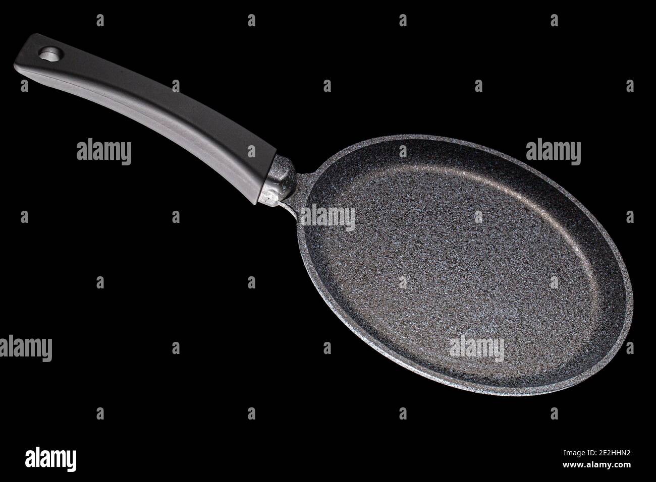 Grey frying pan with non-stick, isolated on black background Stock Photo