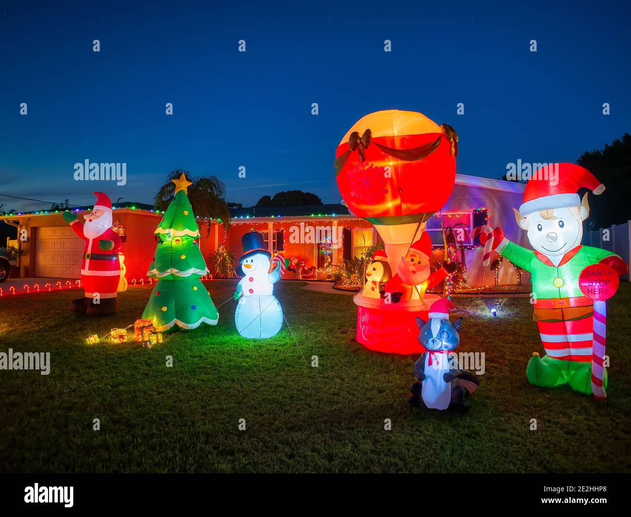Lawn and house decorated with Christmas lights and decorations in southwest Florida USA Stock Photo