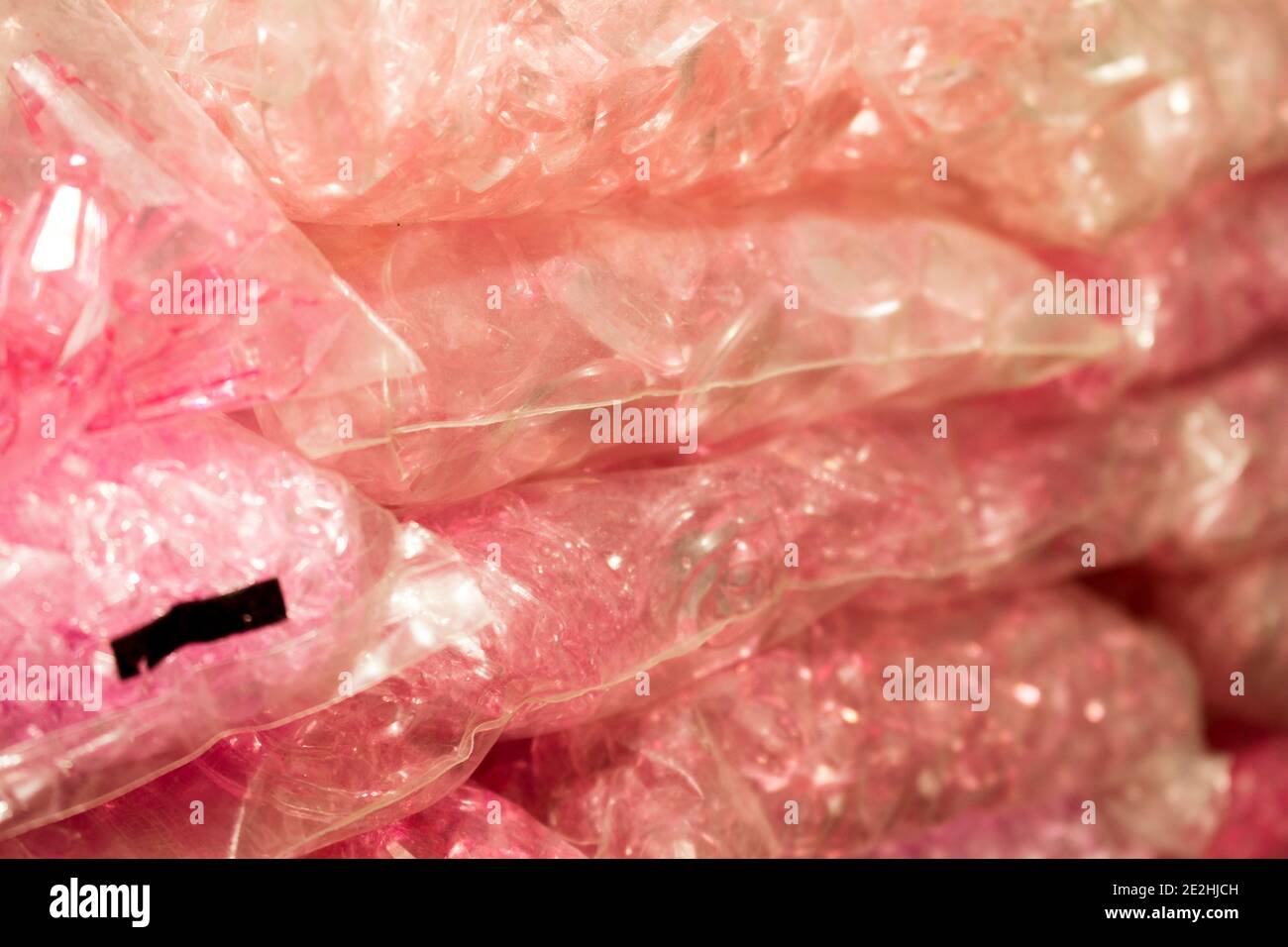 Stacks of pink crystals and pearls packages for bijou Stock Photo