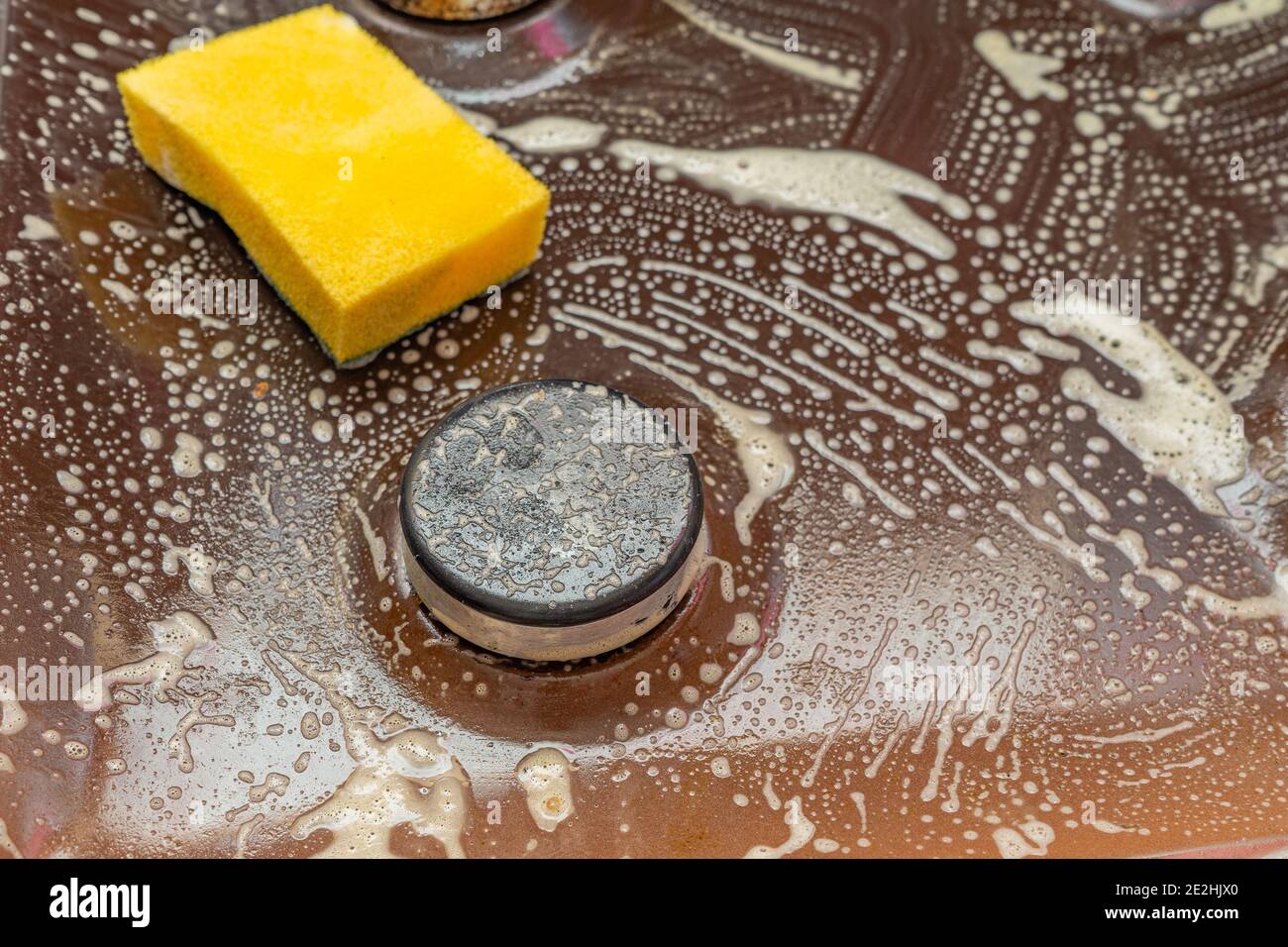 Old dirty gas stove with surface in kitchen from cooking oil stains and