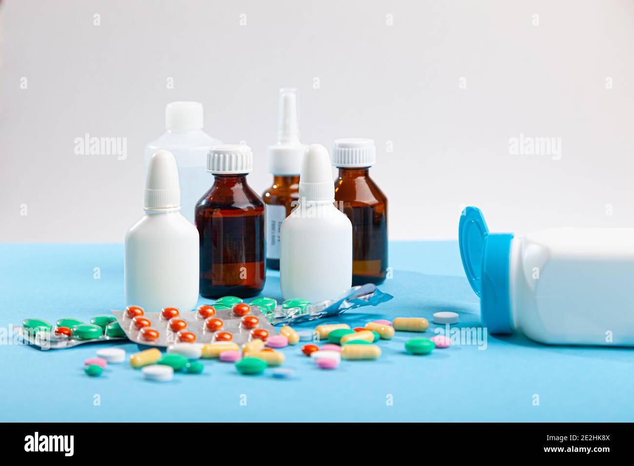 Many medical medicines, thermometer, syringe, spray, bottles of nose