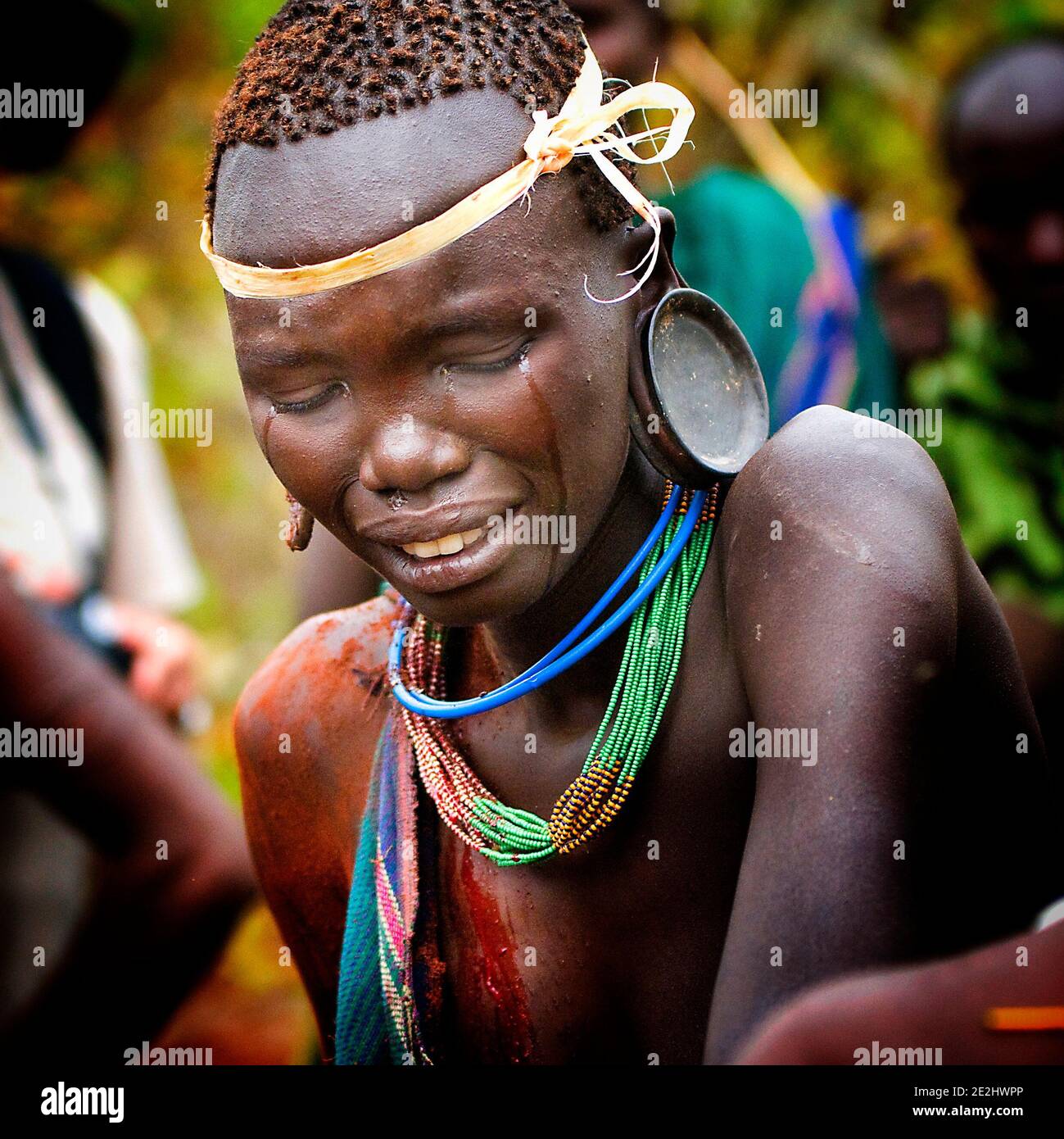 This woman was photographed crying as she watched the violent battles unfold. OMO VALLEY, ETHIOPIA: MEET THE tribe who engage in a violent and bloody Stock Photo