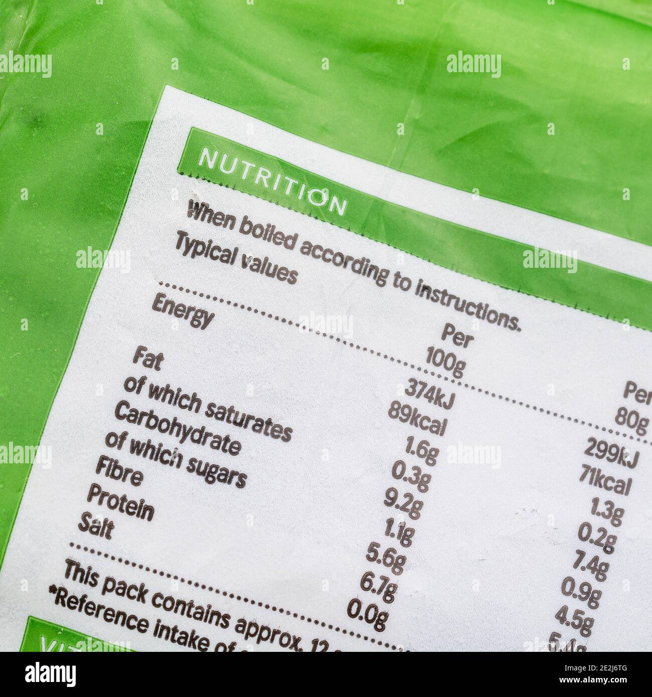 Close-up shot of food Nutrition facts box on plastic wrapper of Tesco frozen Garden Peas. Stock Photo
