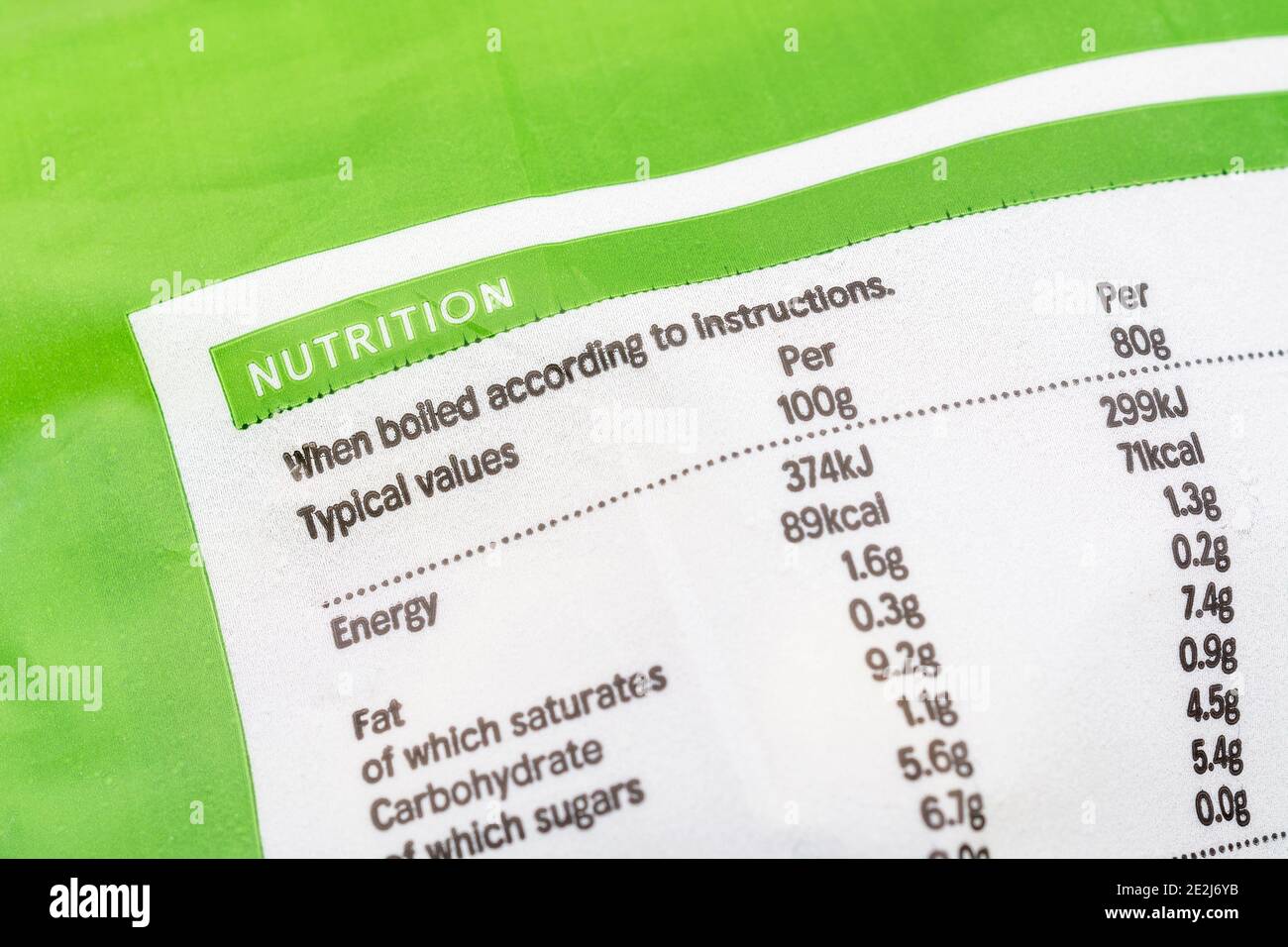 Close-up shot of food Nutrition facts box on plastic wrapper of Tesco frozen Garden Peas. Stock Photo