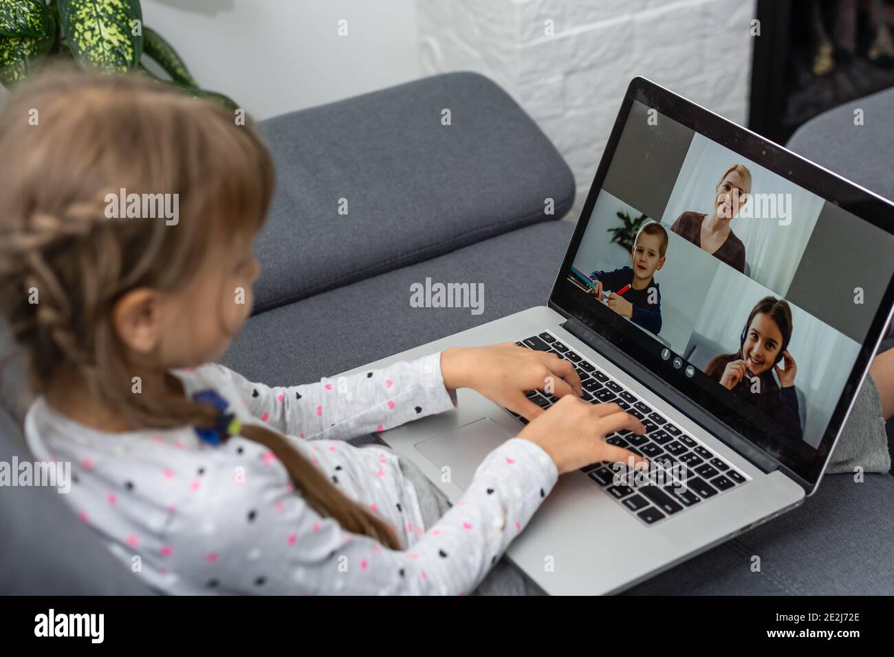 A Girl Video Conferencing With Happy Female Teacher On Laptop Stock ...