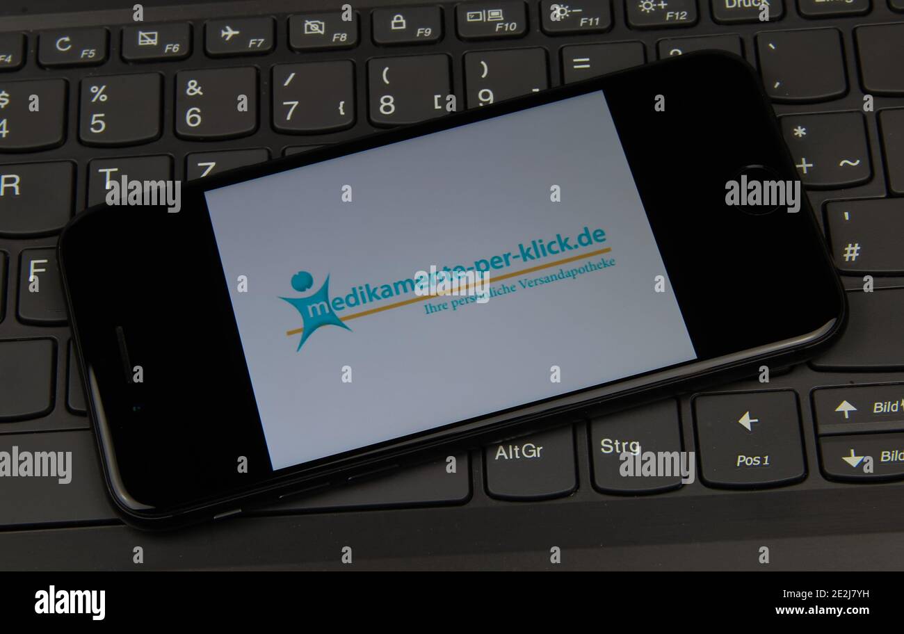 Viersen, Germany - May 9. 2020: Close up of mobile phone screen on computer keyboard with logo lettering of online mail-order pharmacy  medikamente-pe Stock Photo