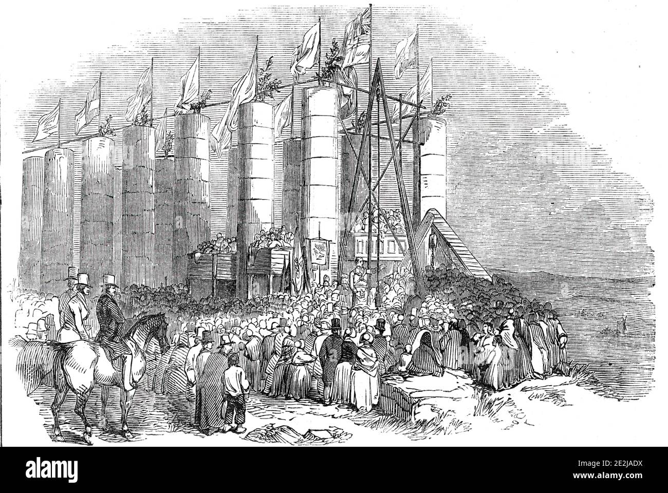 Ceremony of laying the &quot;Foundation Stone&quot; of the Durham Monument, on Penshaw Hill, 1844. The Penshaw Monument in Sunderland, County Durham, was built to commemorate John Lambton, 1st Earl of Durham, Governor-General of British North America. '...the Grand Master, the Earl of Zetland...came up in his radiant costume, with great dignity, preceded by his regal banner, and the Grand Sword Bearer, and followed by the Ionic light, the deputy Grand Master, the Rev. R. Green, Grand Chaplain, and Grand officers, with plumb, line... the ceremony was immediately commenced by the upper foundatio Stock Photo