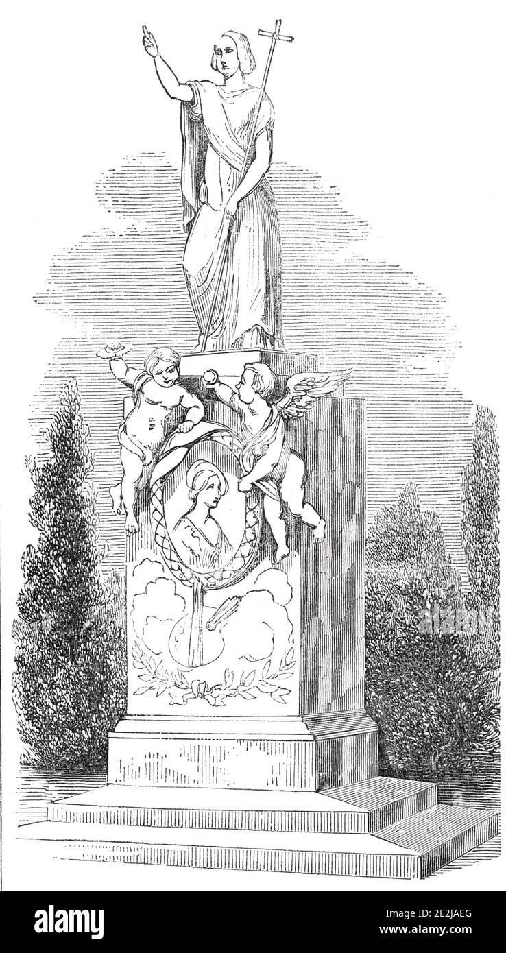 Monument to Madame Soyer, in Kensal Green Cemetery, 1844. The tomb of British painter Emma Soyer, designed by her husband, French chef Alexis Beno&#xee;t Soyer, at Kensal Green in north London. The '...heroic figure of Faith...points with her right hand to Heaven, whilst, in her left, she holds the cross, symbolical of Christianity...On the upper portion of the pedestal are two cherubim...One holds a crown over the head of an effigy of M. Soyer...on a medallion of white statuary marble; whilst the other holds a branch of palm, emblematical of peace. The medallion is surrounded with a serpent, Stock Photo