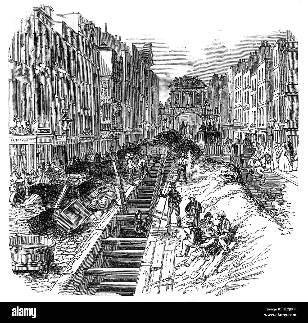 Fleet-Street, deepening the sewer, 1845. Workers improving the underground waste system in London, with Temple Bar in the distance. '...the difficulty of keeping open the traffic, so as not to extinguish the &quot;very animated appearance&quot; of Fleet-street, is a work of much difficulty. The cost of the present undertaking, contracted for by Messrs. Ward and Son, of Aldersgate- street, is &#xa3;2000...There do not appear to be published data from which the total extent of the metropolitan Sewers can be ascertained. The Holbom and Finsbury divisions contain eighty three miles. In addition to Stock Photo