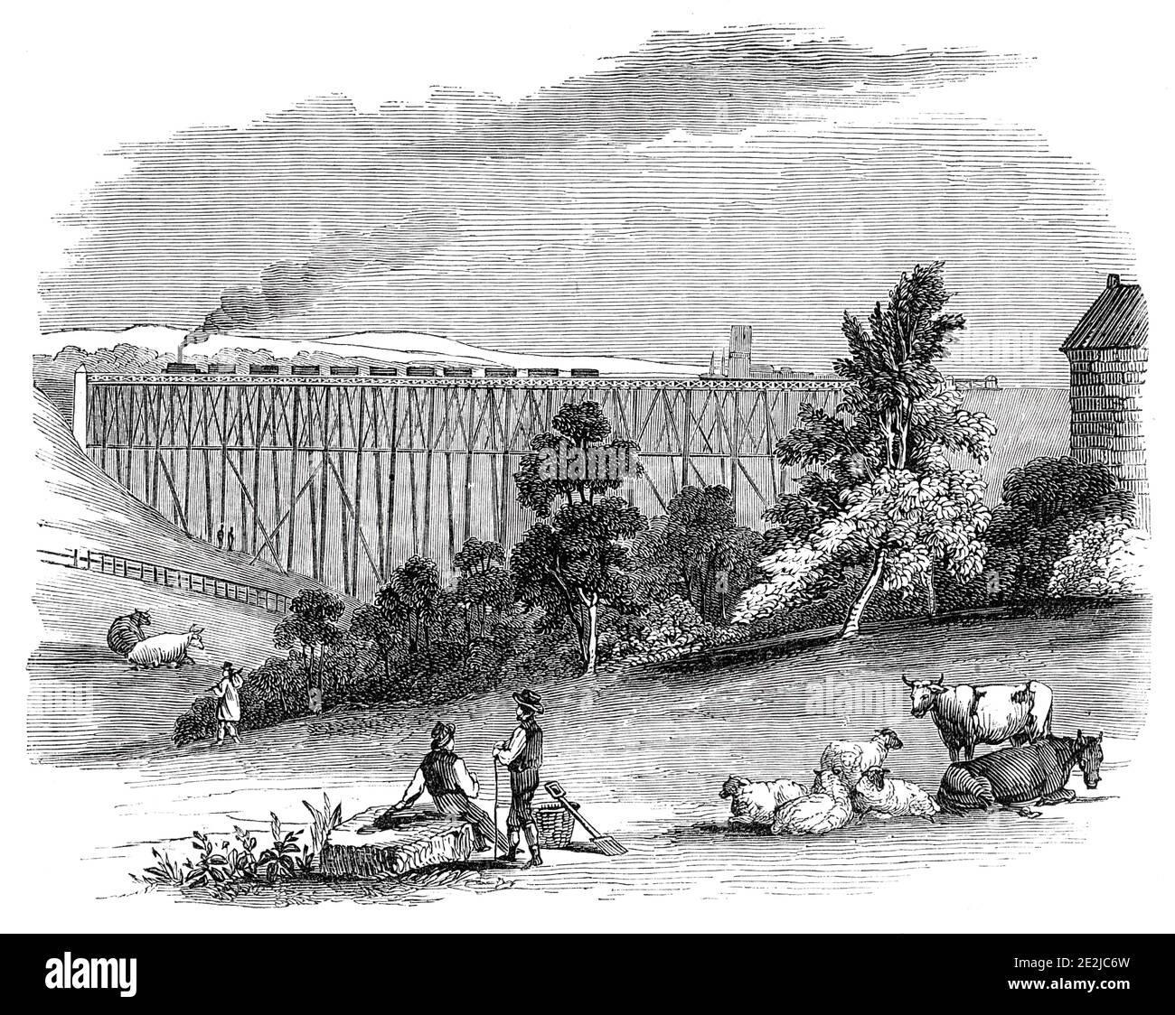 Timber Viaduct on the Darlington and Newcastle Railway, 1844. Railway bridge over the River Sherbourne. 'The value of timber viaducts, as the means of effecting the economical construction of railways, is a point of engineering practice becoming daily of greater importance. Those on the Newcastle and Darlington railway are the work of Mr. Harrison. The Sherburn construction is from 60 to 70 feet high; it is founded on piles driven 35 feet into the ground; several courses of masonry rest on these piles, and from the masonry spring the light tall timber baulks that support the railing. A single Stock Photo