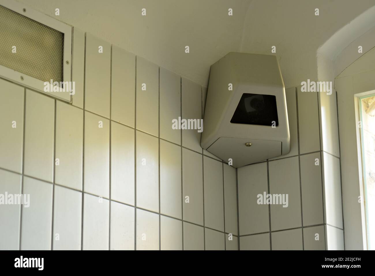 Surveillance camera in a corner of a high secured jail cell Stock Photo
