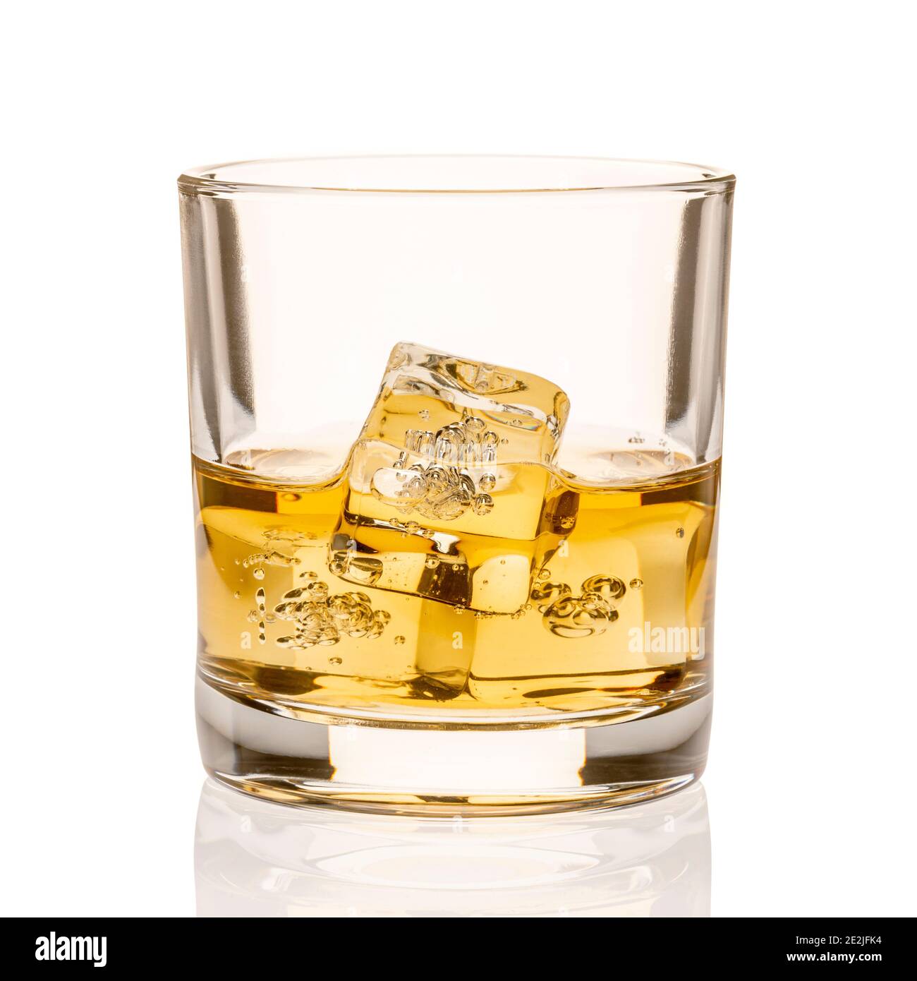 Whiskey in glass with ice cubes Stock Photo