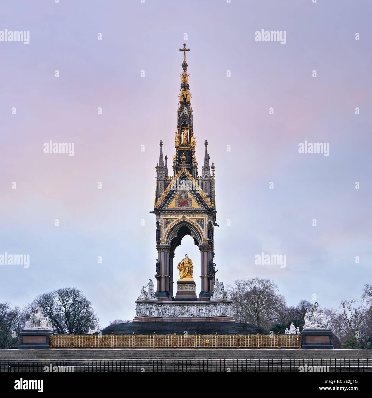 Albert Memorial with golden prince statute (opened in 1872) in Kensington, London, clear cold winter afternoon sky in background Stock Photo