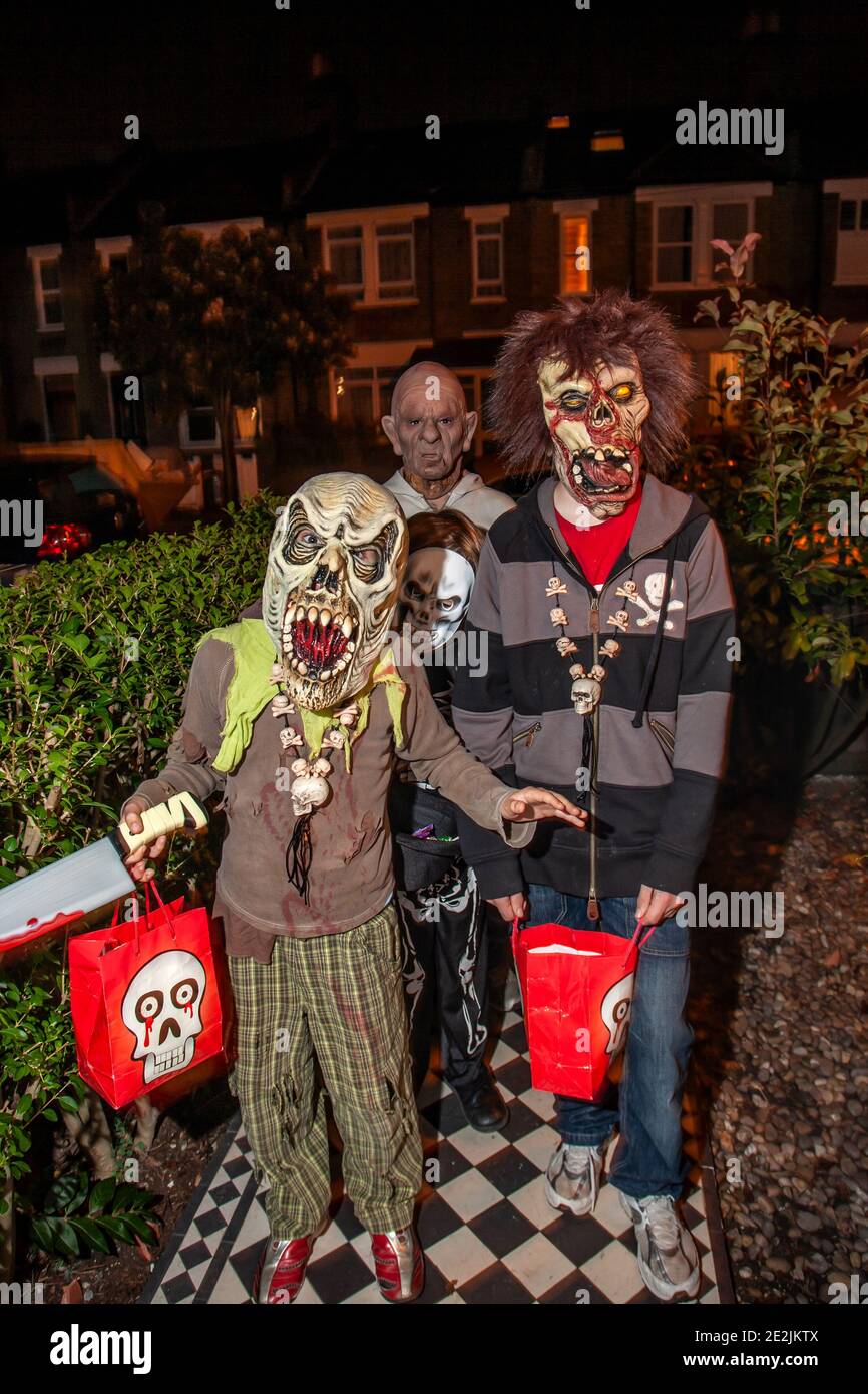 Halloween, children dressed in costume for 'Trick or Treat' around the neighbourhood houses, London, England, UK Stock Photo