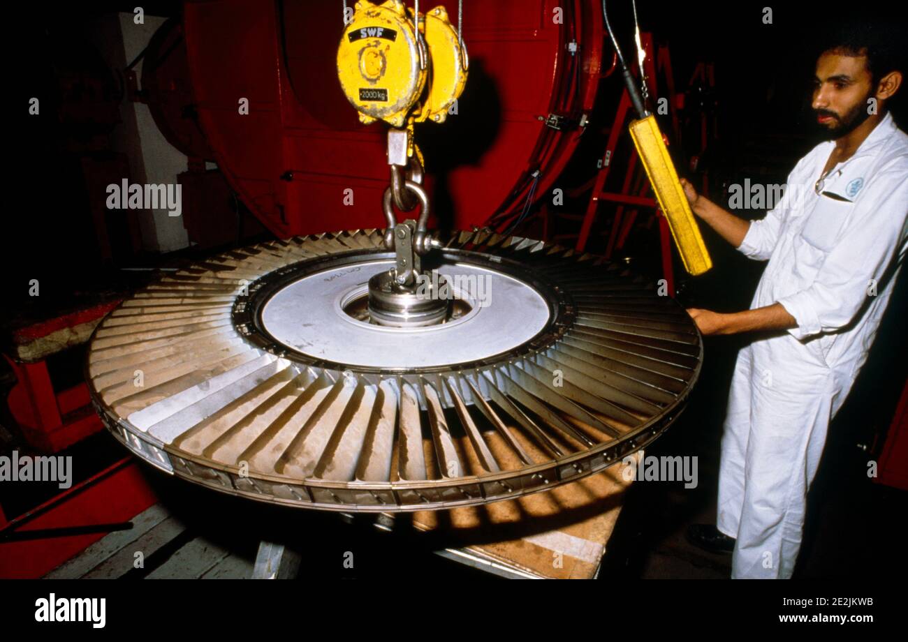 Saudi Arabia Enigineer with Aircraft Engine on crane Stock Photo