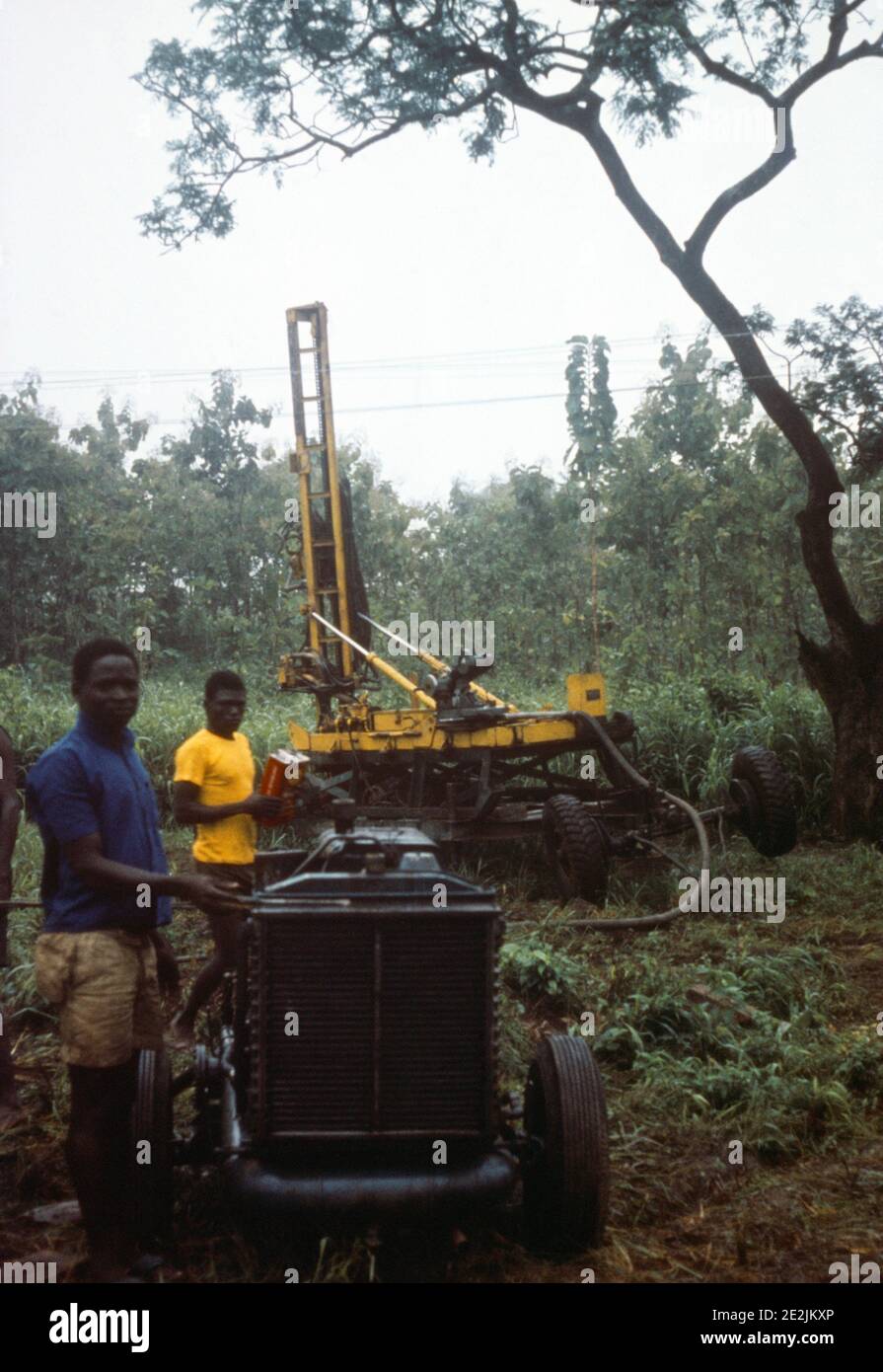 Nigeria Men with Machinery Drilling for Water Stock Photo