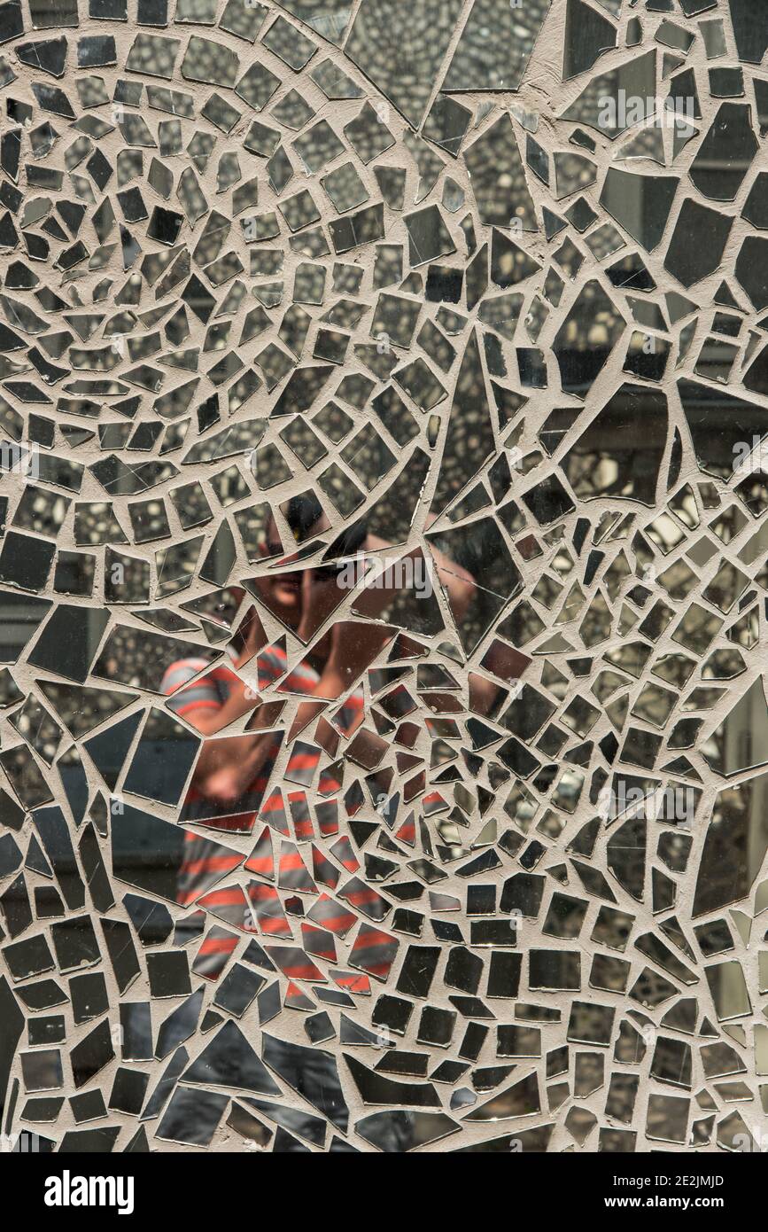 a selfie in some mosaic mirrored street art Stock Photo
