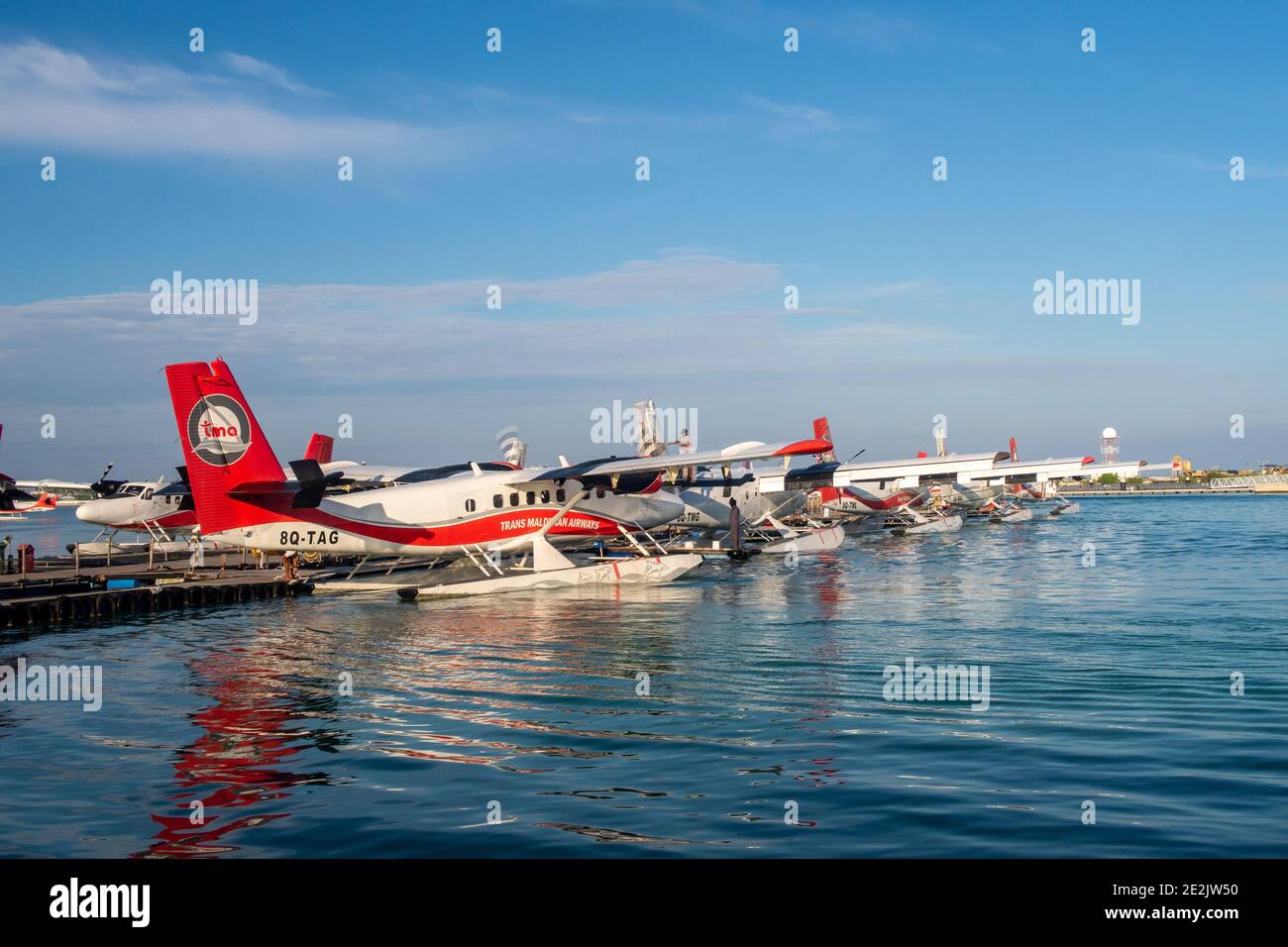 Male, Maldives, 20.11.2020. Trans Maldivian Airways terminal and dock, with seaplanes Twin Otter Series 400 fleet docked. Stock Photo
