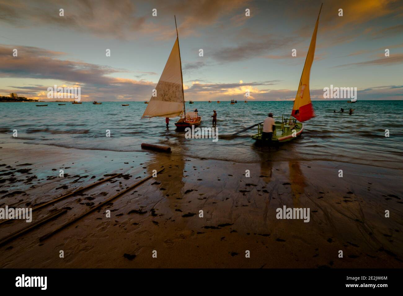 Sunset and tourist boats on a beach in Maceió, Brazil Stock Photo