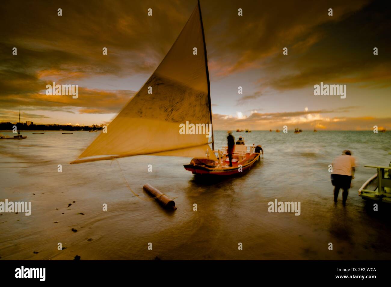 Sunset and tourist boats on a beach in Maceió, Brazil Stock Photo