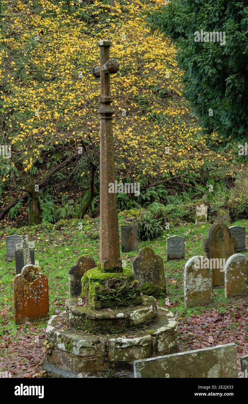 The old cross at St Beuno's Church at Culbone, the smallest parish church in England. On Exmoor, West Somerset. Stock Photo