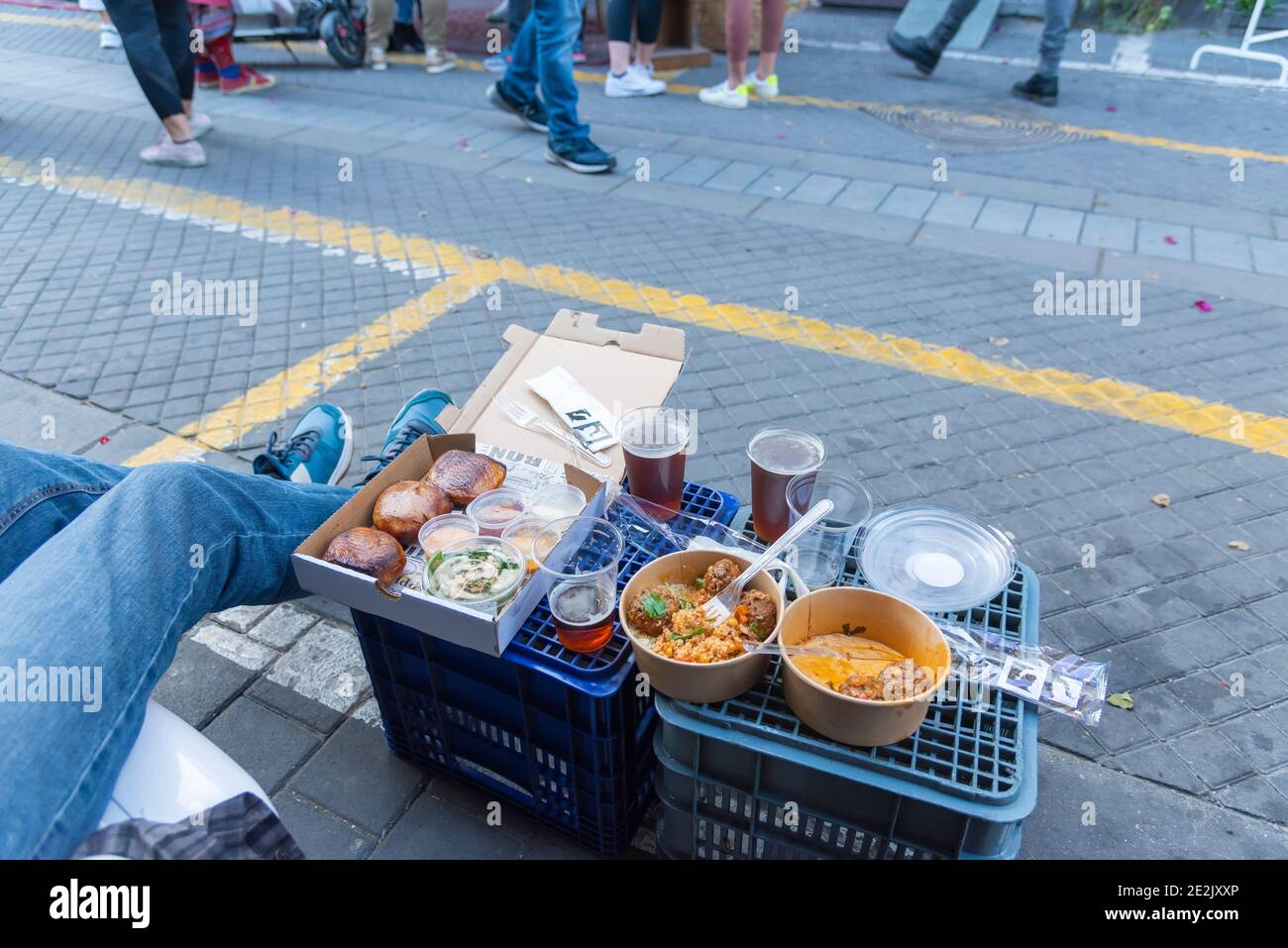 Eating out during the pandemic. Arais, beer, couscous, meat ballscold. Outdoors eating with covid19. High quality photo. Israel, Tel Aviv, Jaffa, flea market Stock Photo